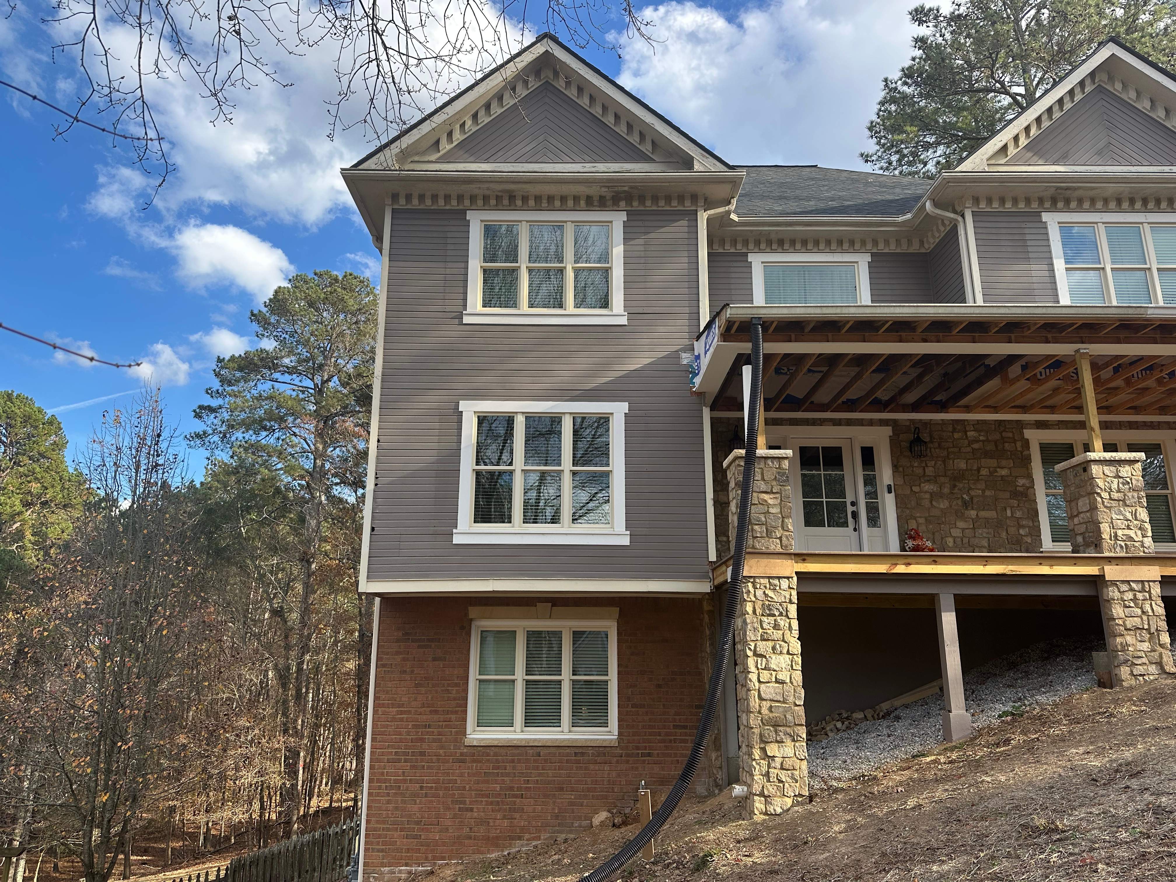 James Hardie Siding Replacement, Exterior Painting, Deck Stain, and Gutter Installation in Peachtree Corners, GA by Nelson Exteriors