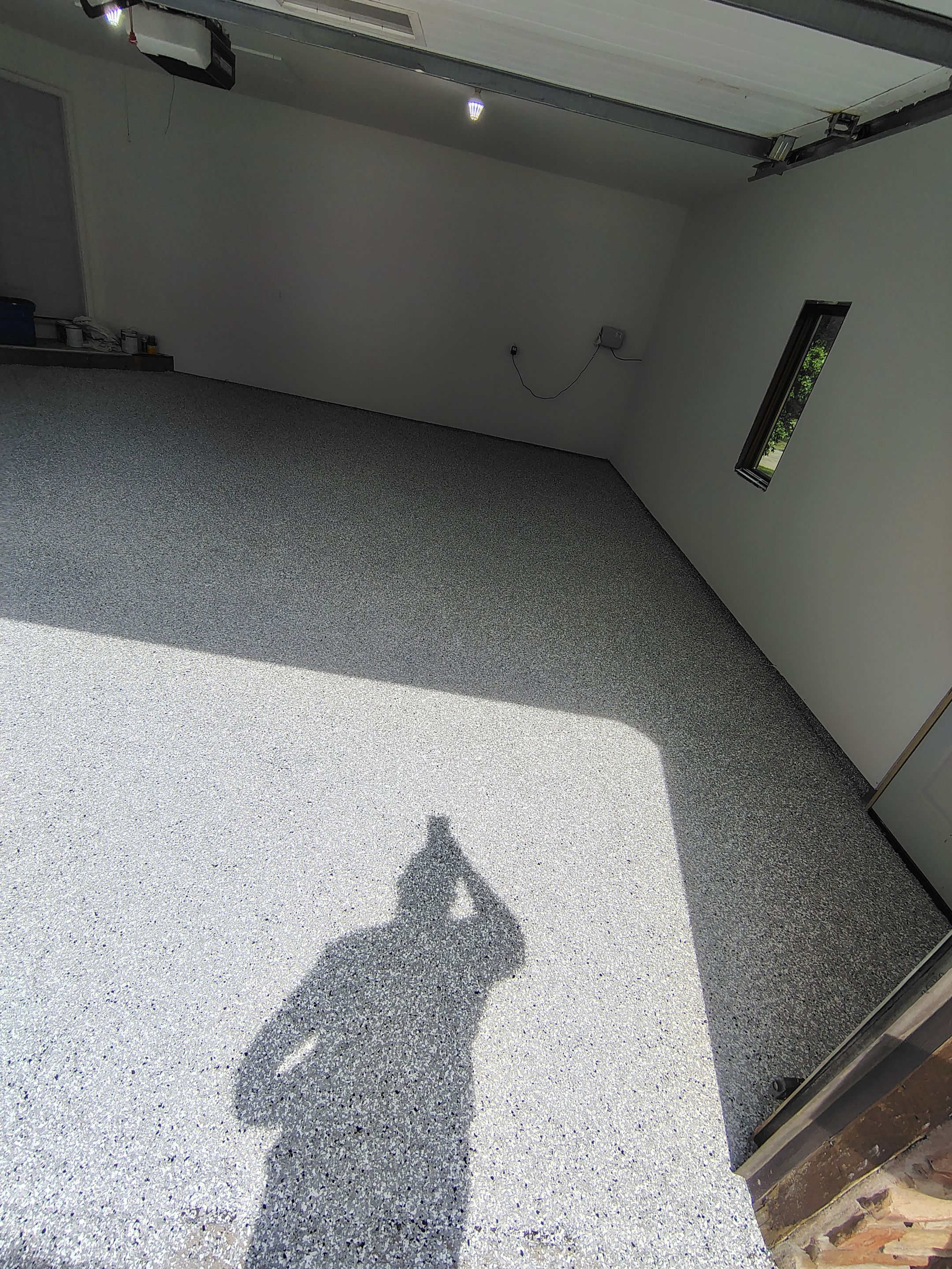 Sioux Falls Garage Floor Coating with Speckled Flake Finish by Select Painting, Coatings & Garage Cabinets