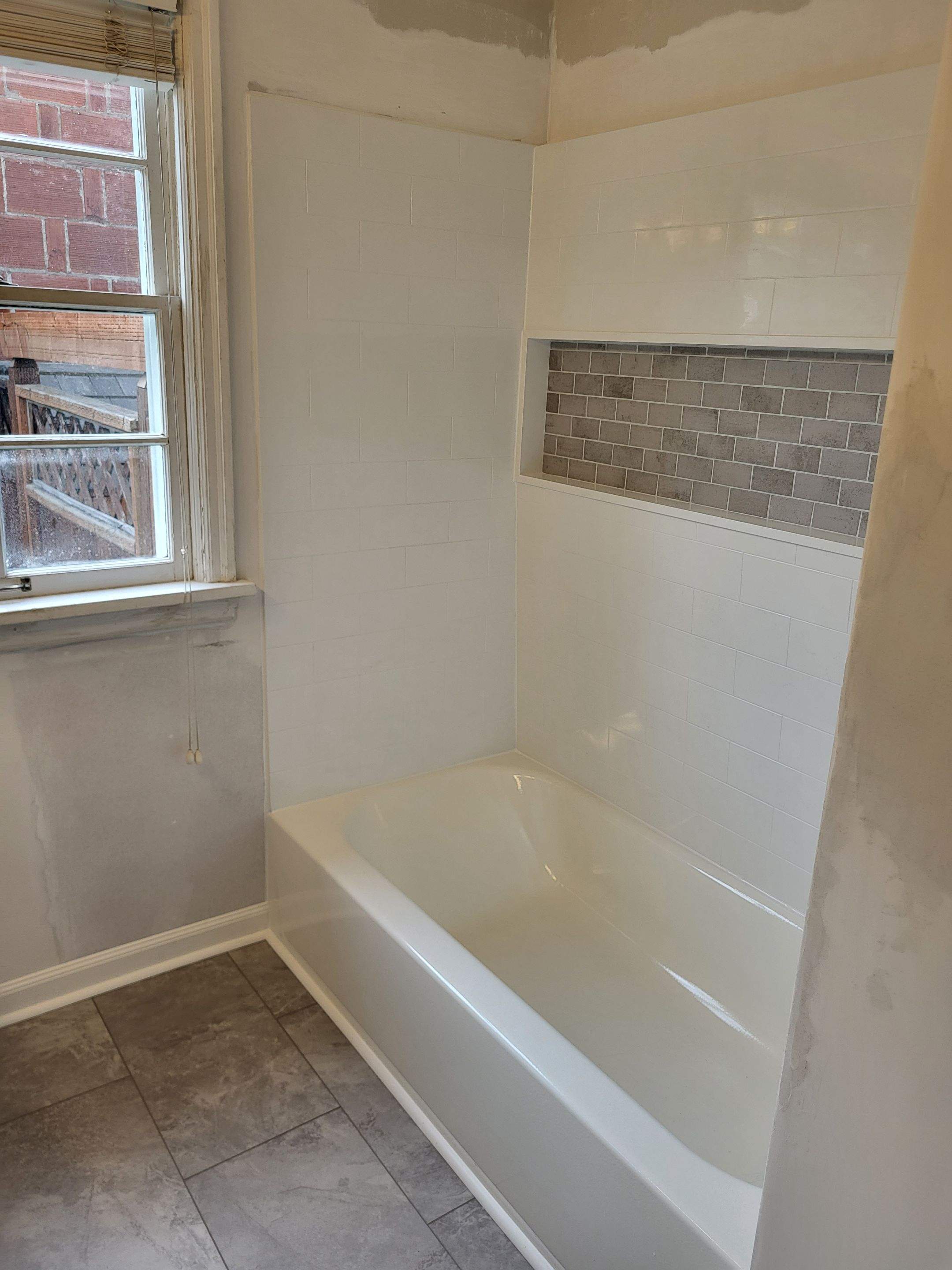 Modern Bathroom Remodeling With Dual Vanity and Subway Tile by American Made Construction