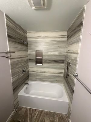 San Diego in Mira Mesa Modern Bathtub Replacement and Marble Wall Panel Installation