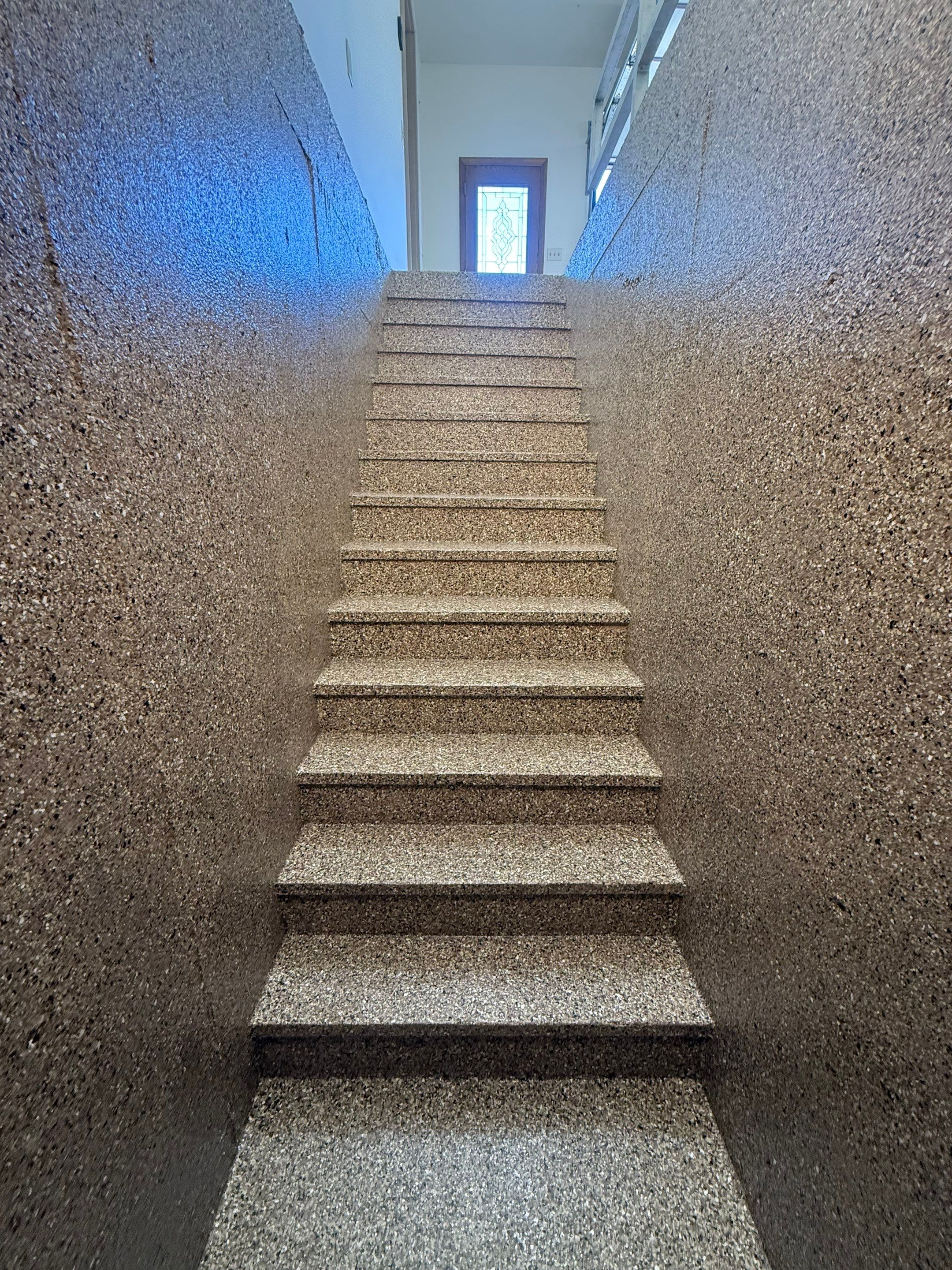 Custom Polyaspartic Garage Floor and Stairwell Coating in Pipestone by Select Painting, Coatings & Garage Cabinets