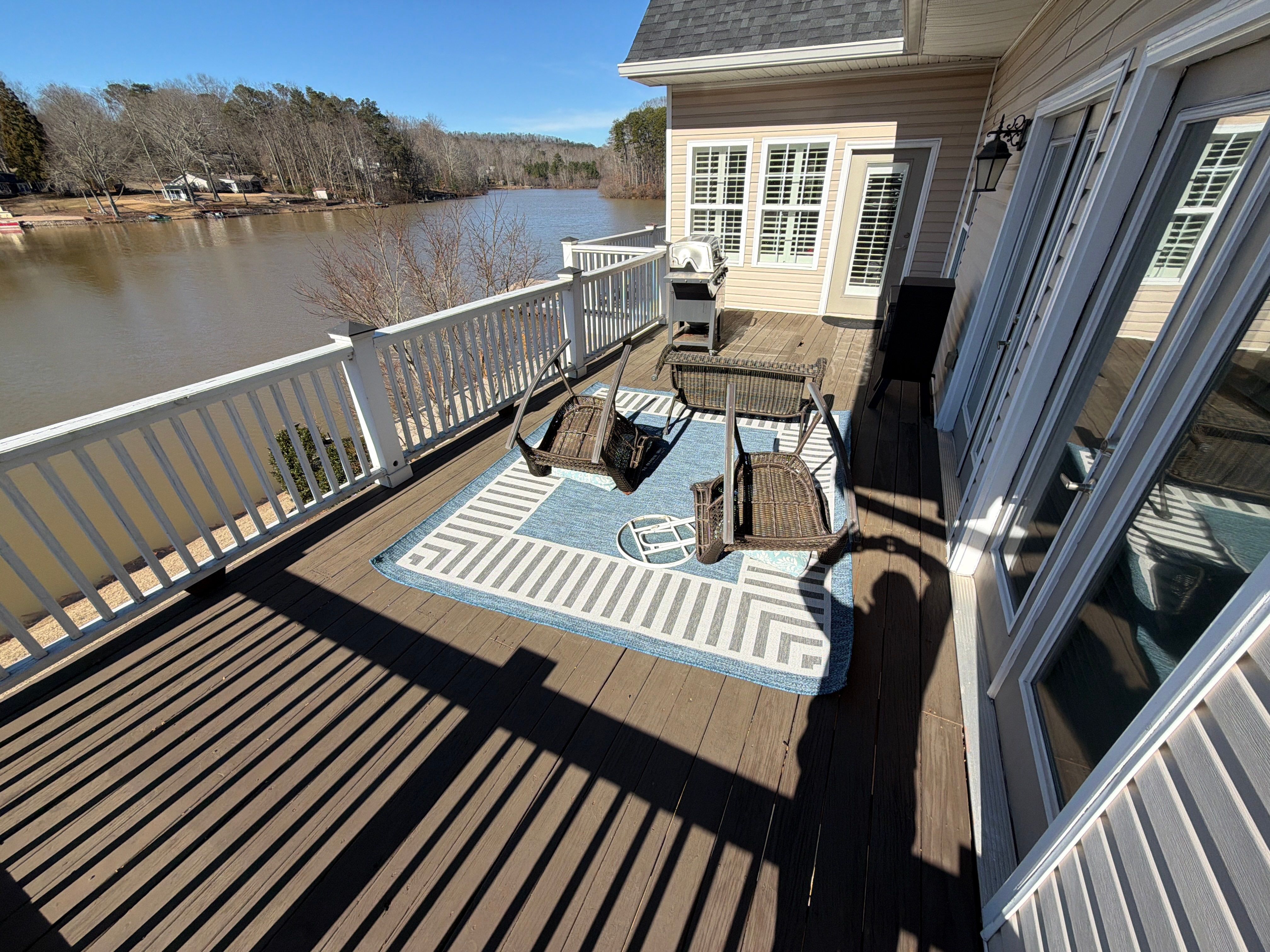 Cumming, GA Lake House Deck Resurface and Extension using Pressure Treated Pine and Skyline Cable Railing by Nelson Exteriors 