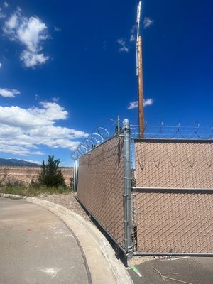 Commercial using 8'+1' 9ga chain link with slats and razor wire