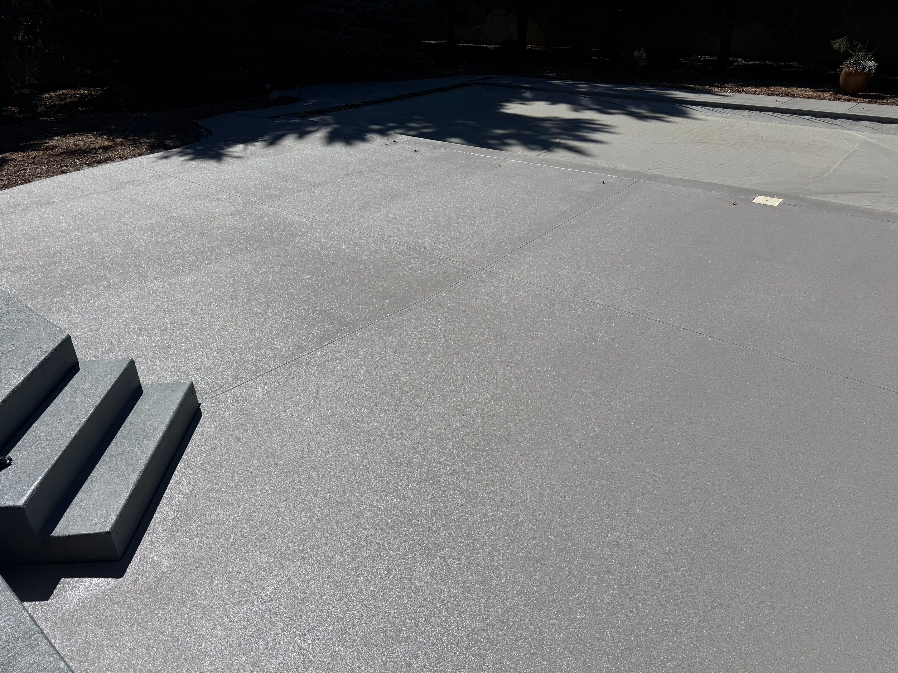 Decorative Concrete Pool Deck and Patio Resurfacing in Sioux Falls by Select Painting, Coatings & Garage Cabinets