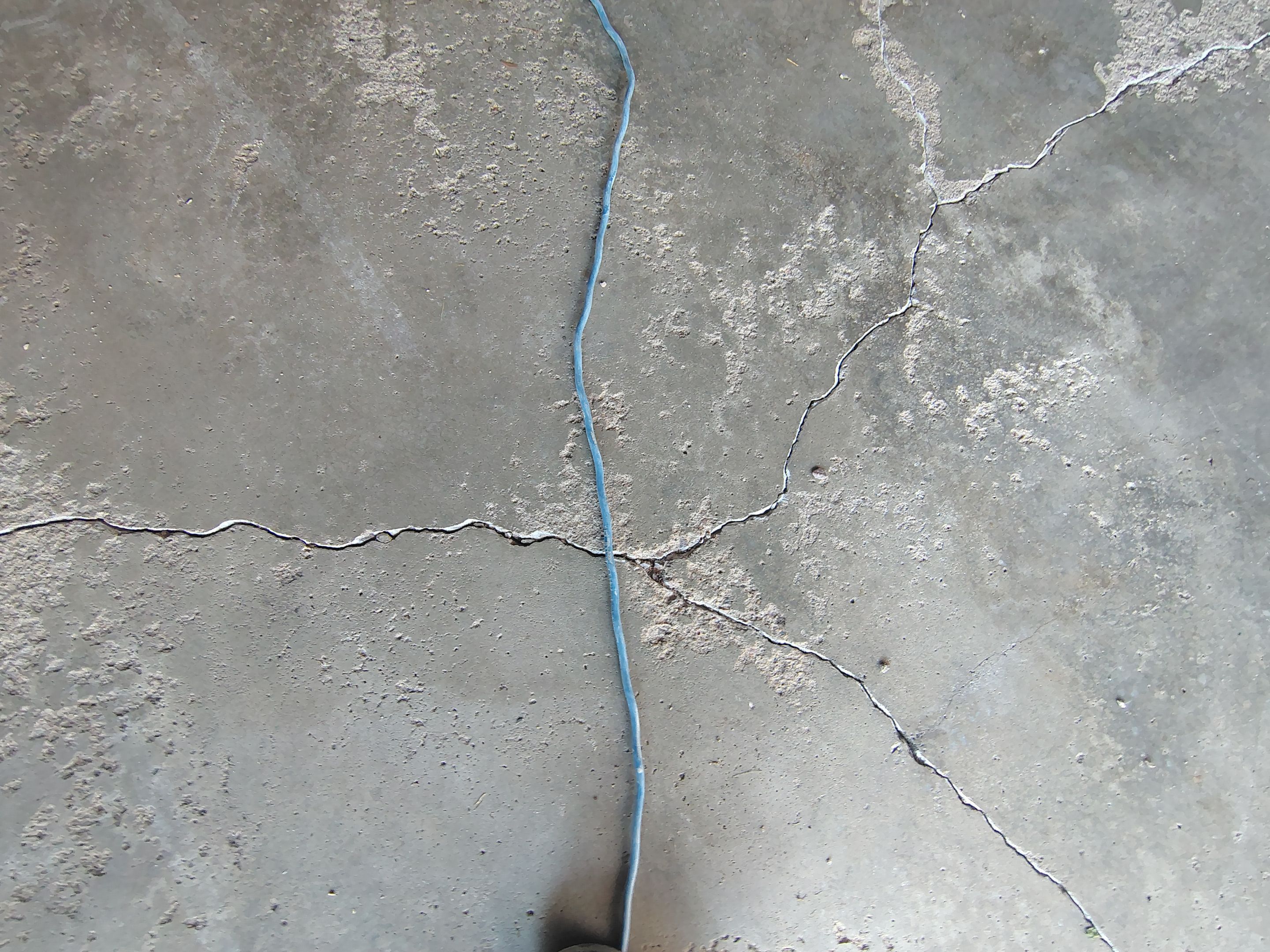 Sioux Falls Garage Epoxy Floor Installation and Concrete Crack Repair by Select Painting, Coatings & Garage Cabinets