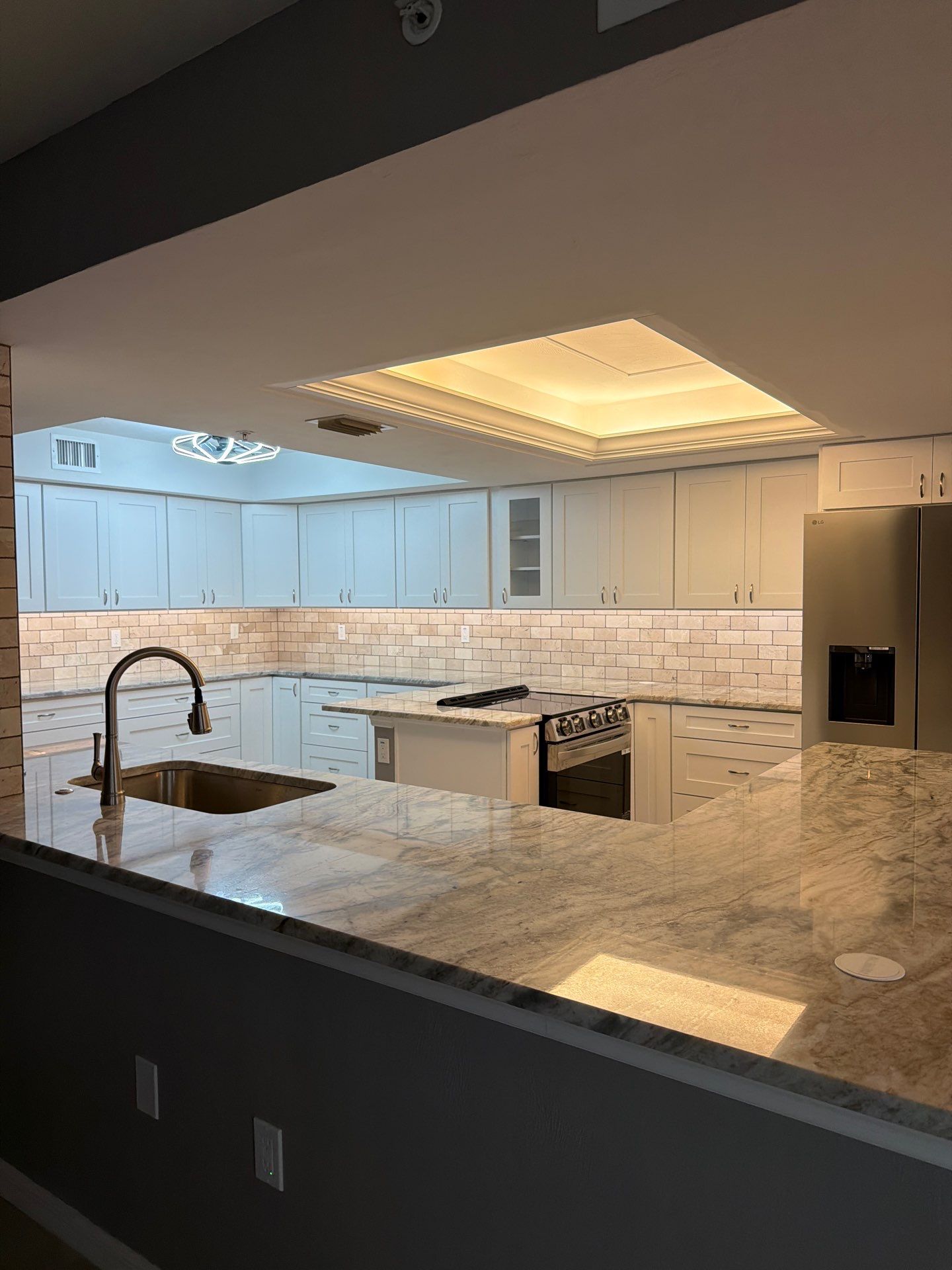 Completely Re-imagined Modern Condominium Kitchen Remodel  by Acies Renovations