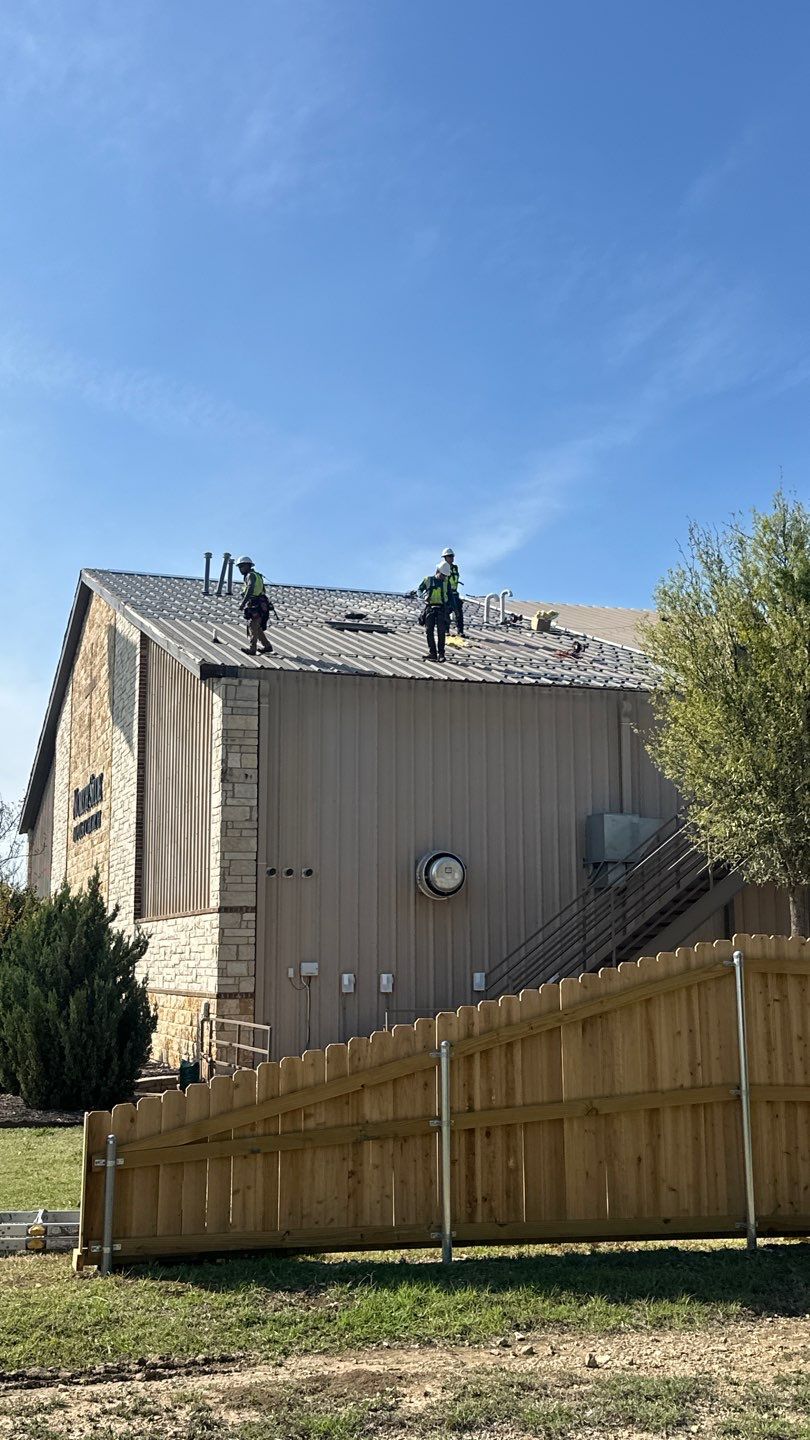 Commercial Roofing Installation using 24 GA 2" Seam Metal Retrofin - Buckskin by Action Exteriors Austin