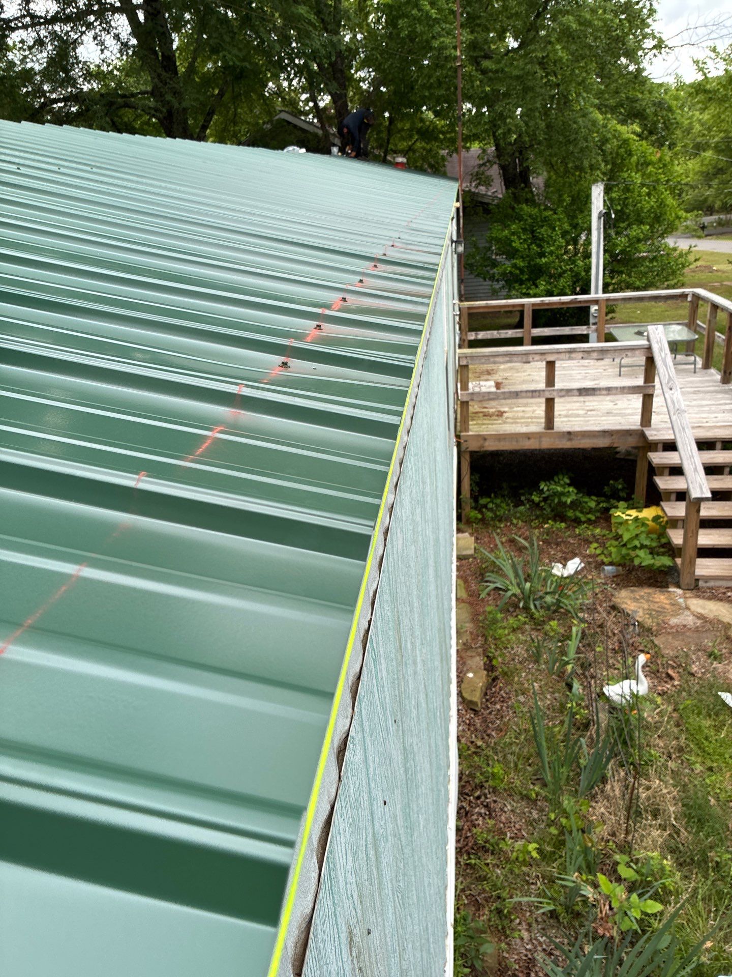 Metal roof installation by In & Out Construction & Remodeling, LLC