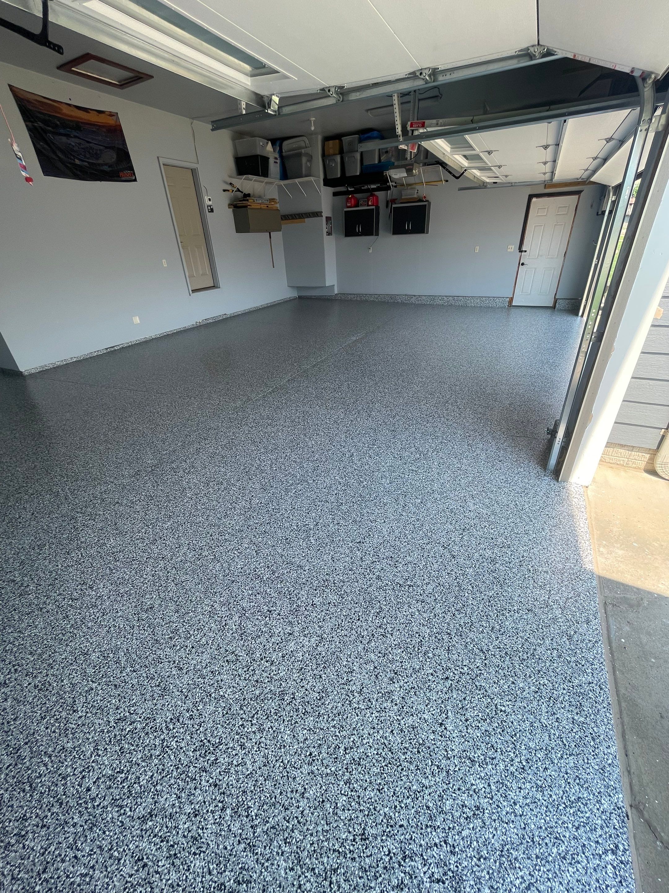 Sioux Falls Garage Concrete Coating Installation with Domino Flake by Select Painting, Coatings & Garage Cabinets
