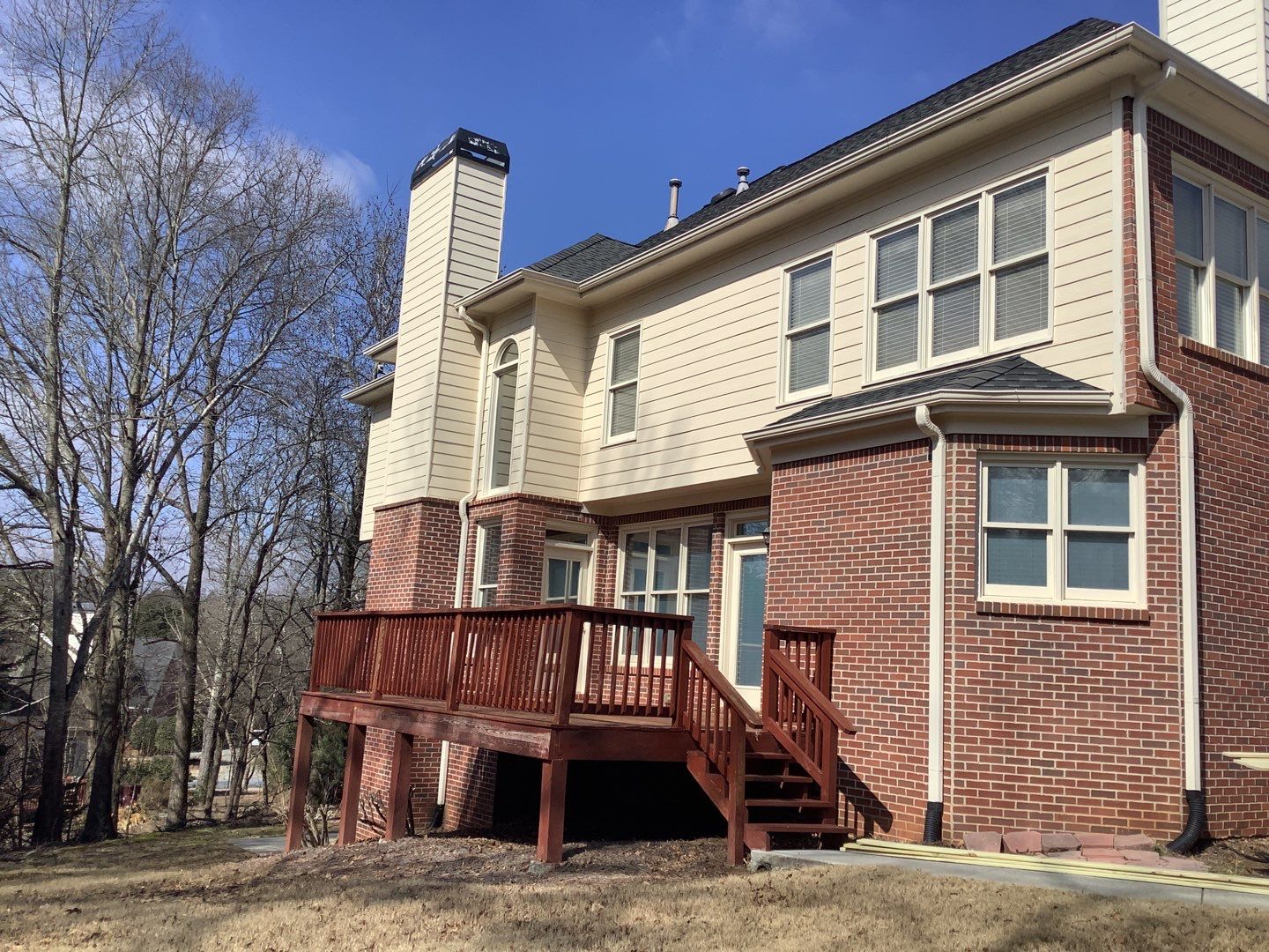 White Brick Exterior Painting and Deck Refinishing in Duluth by Swift Home Renovations