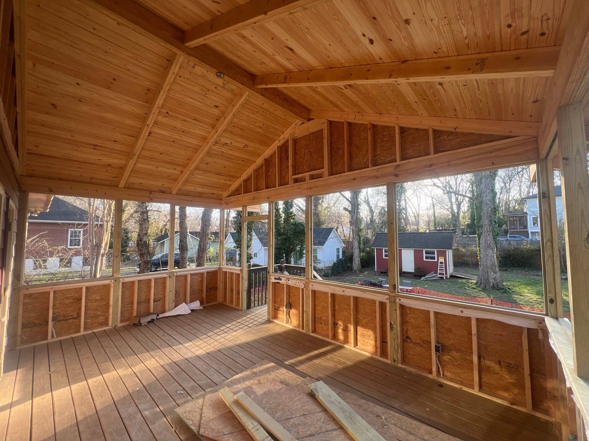 Elevated Screened-In Porch Addition with Vaulted Tongue-and-Groove Ceiling by Swift Home Renovations