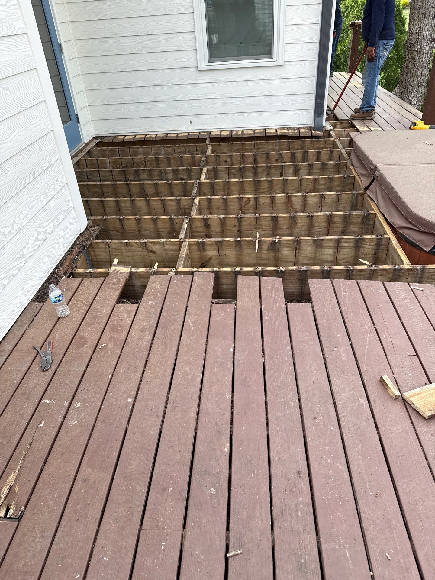 Deck Resurface with Glass Paneling and Deckorators Voyage Series Products by Nelson Exteriors 