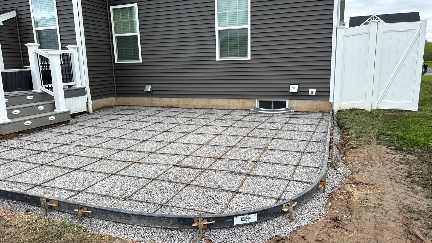 Majestic Ashlar stamped concrete patio  by NG Masonry & Construction LLC