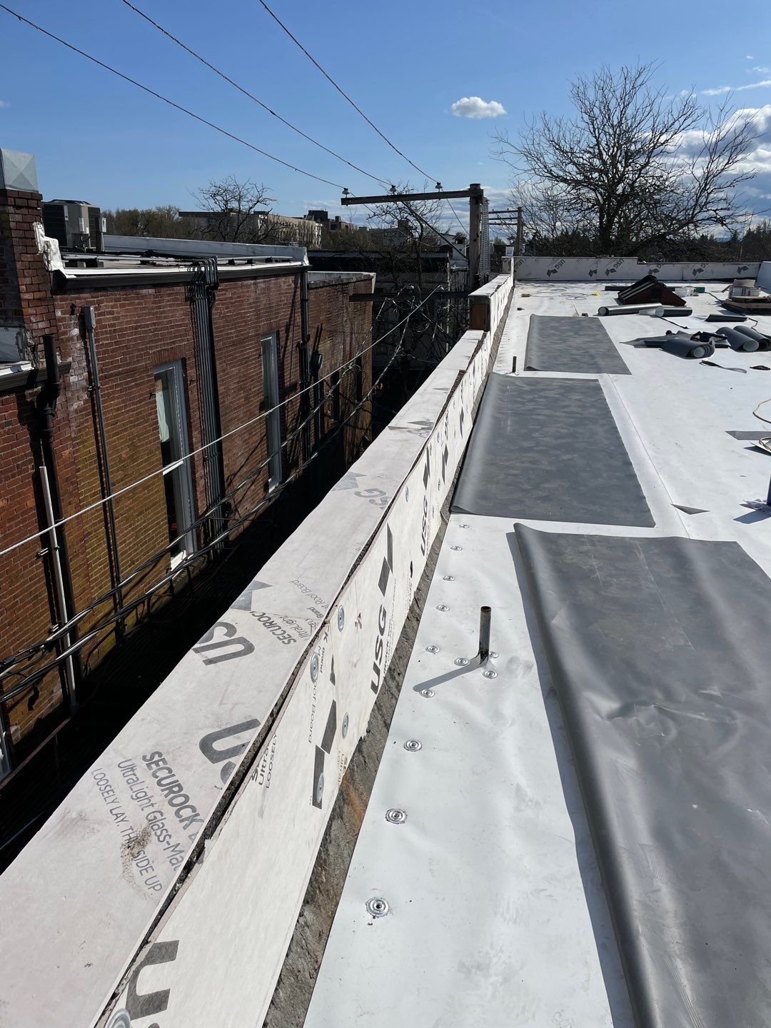 Commercial Flat Roof Installation using GAF 60Mil TPO  by Orezona Building & Roofing Company, Inc.
