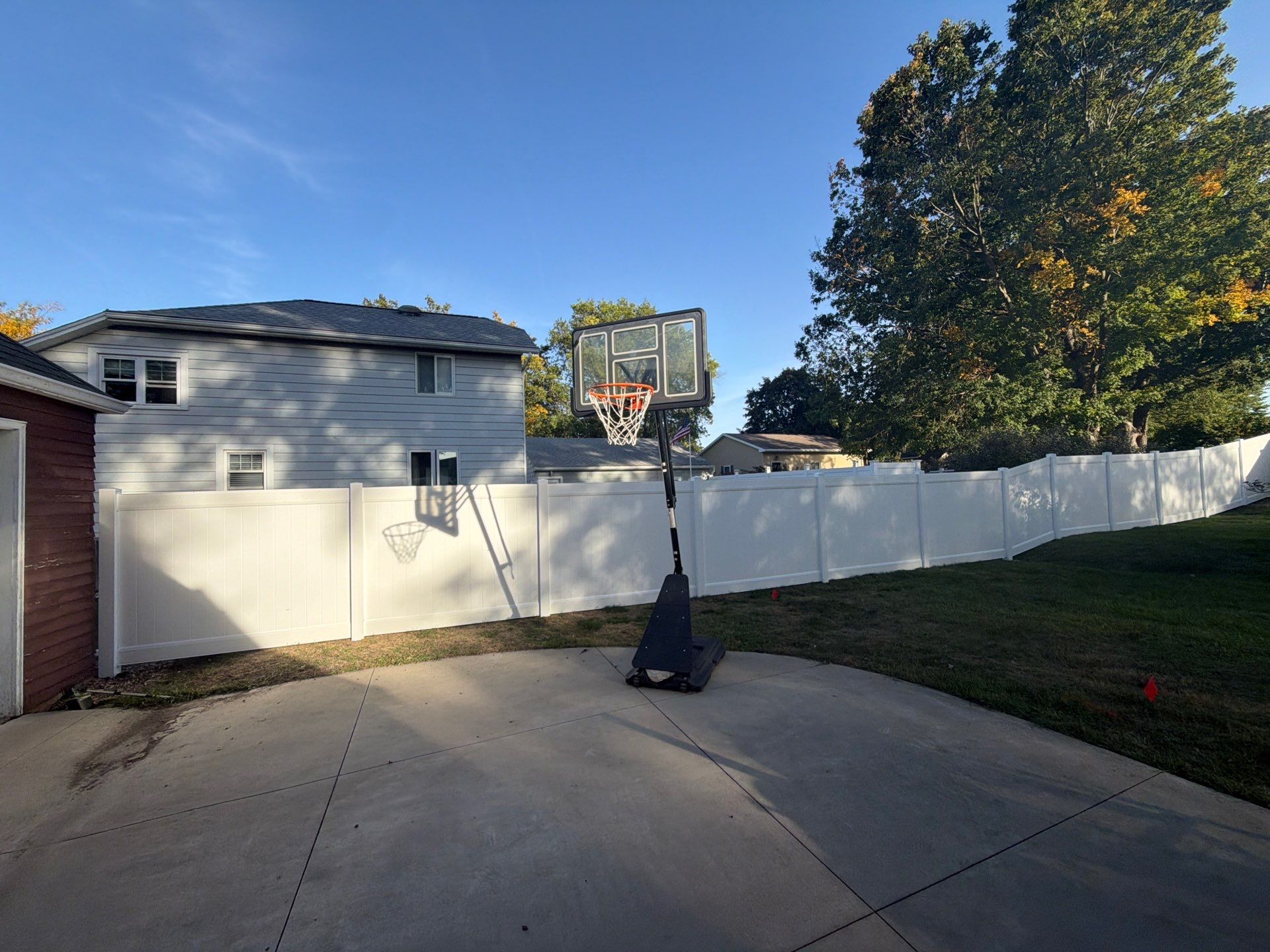 White Vinyl Privacy Fence and Gate Installation in Grundy Center by Perfect Picket Fence and Stain