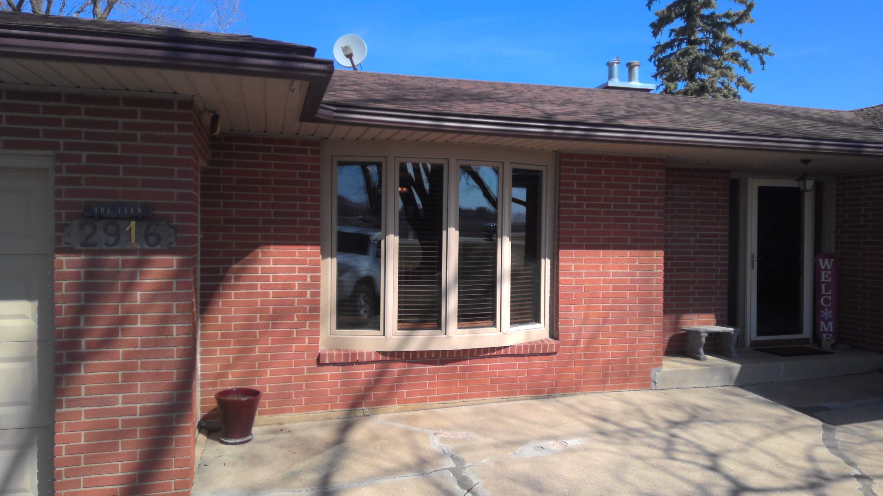Bow window replacment using Pella Lifestyle wood/Aluminum window by United Windows and Siding LLC