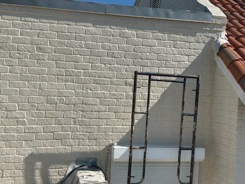 Off with the Tile and on with the TILCOR stone coated metal.  by Bayfront Roofing and Construction