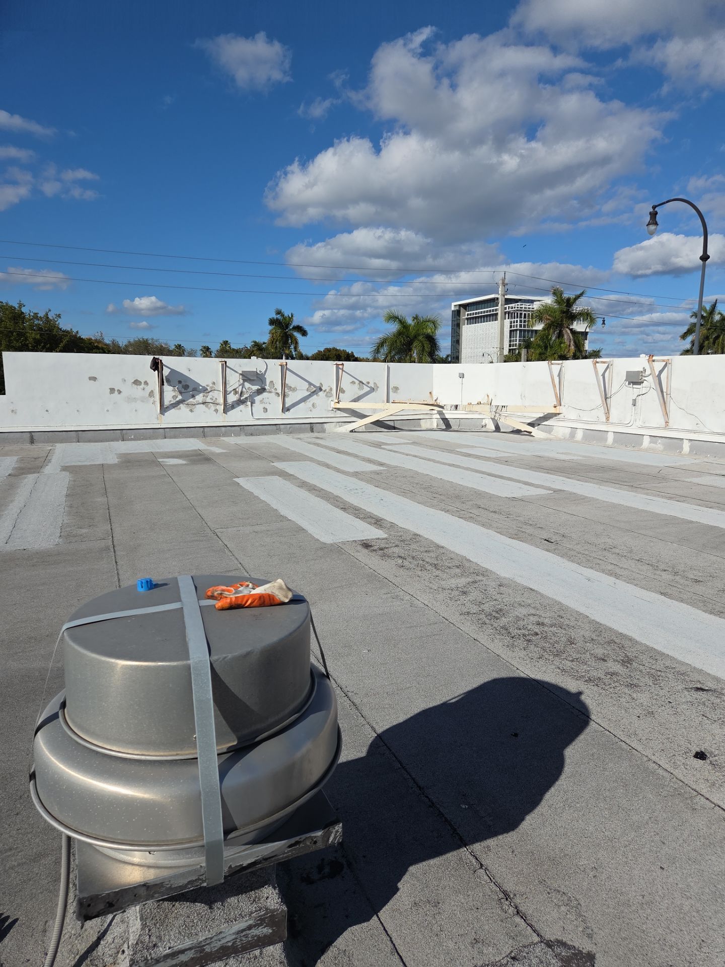Commercial Flat Roof Restoration Using Silicone Coating in Hallandale Beach by Aastro Roofing