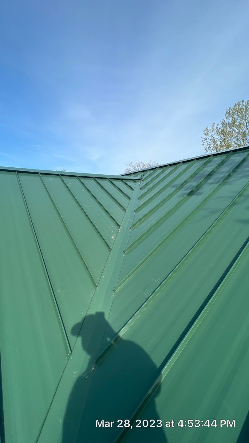 Shingle to Standing Seam Metal Roof by Springtree Restoration 