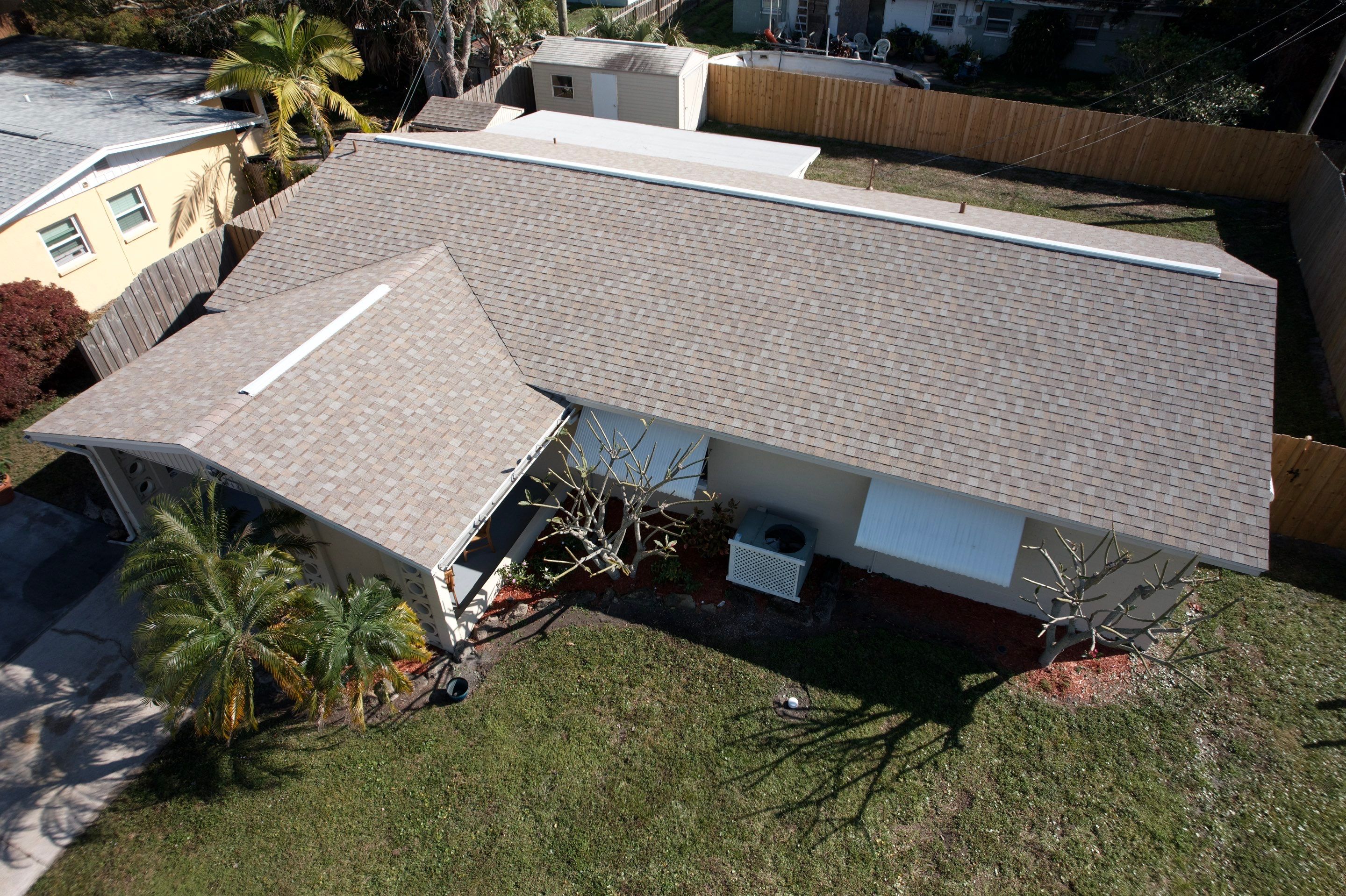 Complete Asphalt Shingle and Flat Roof Replacement in Merritt Island by Wiedmann Construction & Roofing