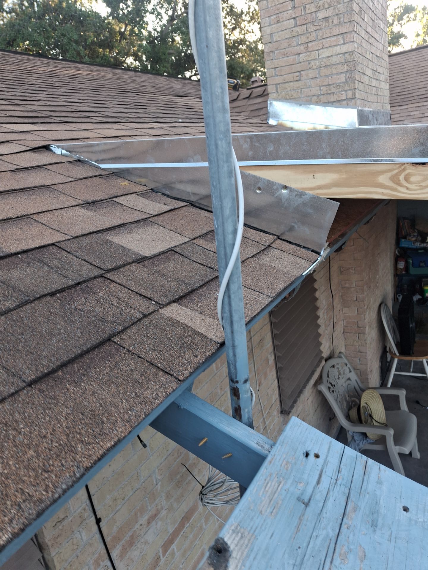 Chimneys need a Cricket.  by Bayfront Roofing and Construction