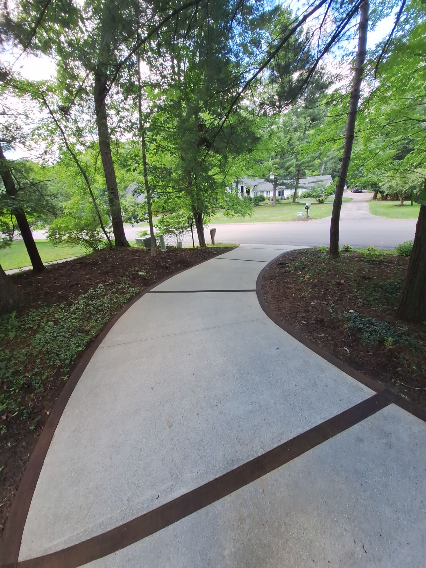 Concrete Driveway and Walkway Staining With Espresso Borders in Grand Rapids by Gordon Painting