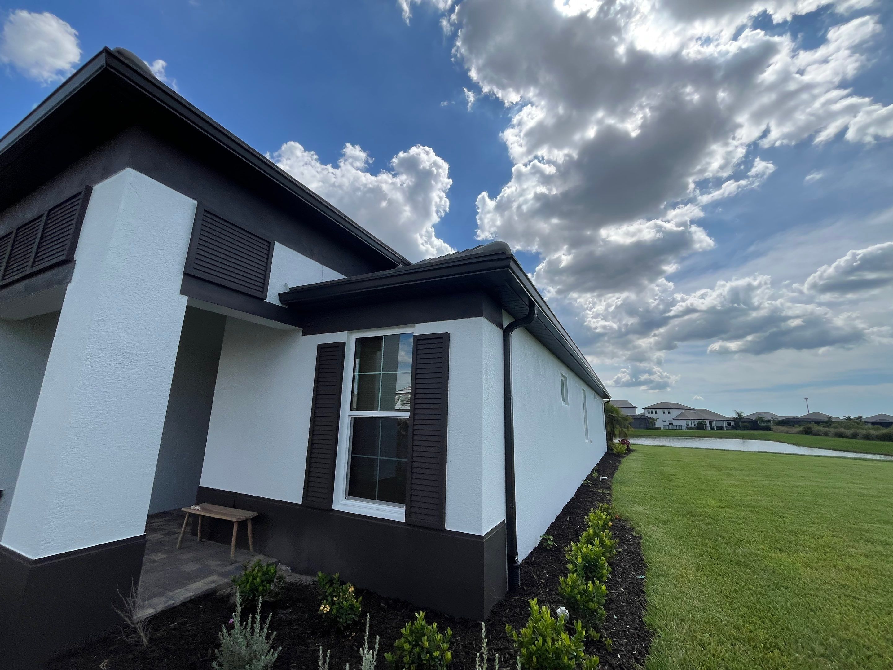 Modern Black Bronze Seamless Gutters for a Stylish Home by Gutter Professors