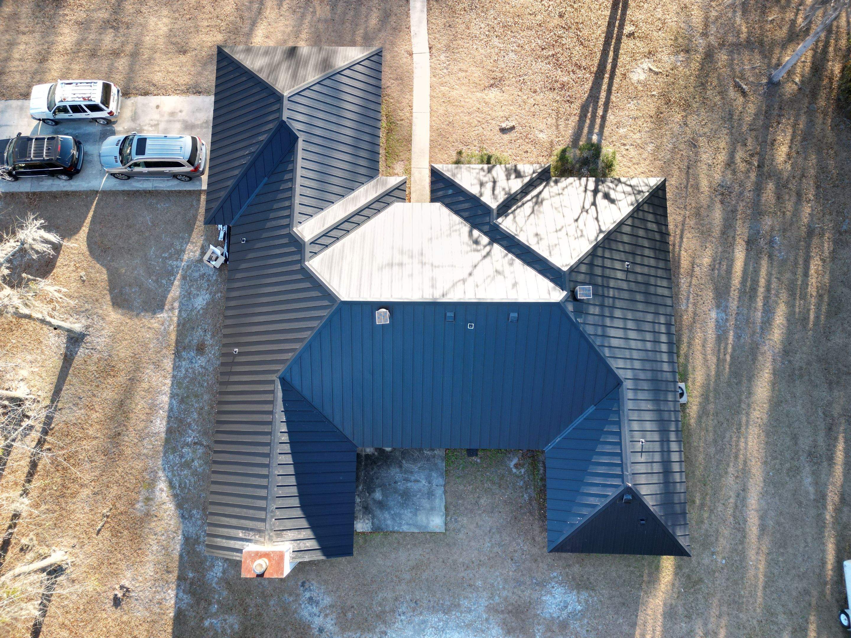Residential Roofing Installation using Benton 26Ga 1inc Snapcock Metal Roof KYNAR Matte Black by Talya Roofing