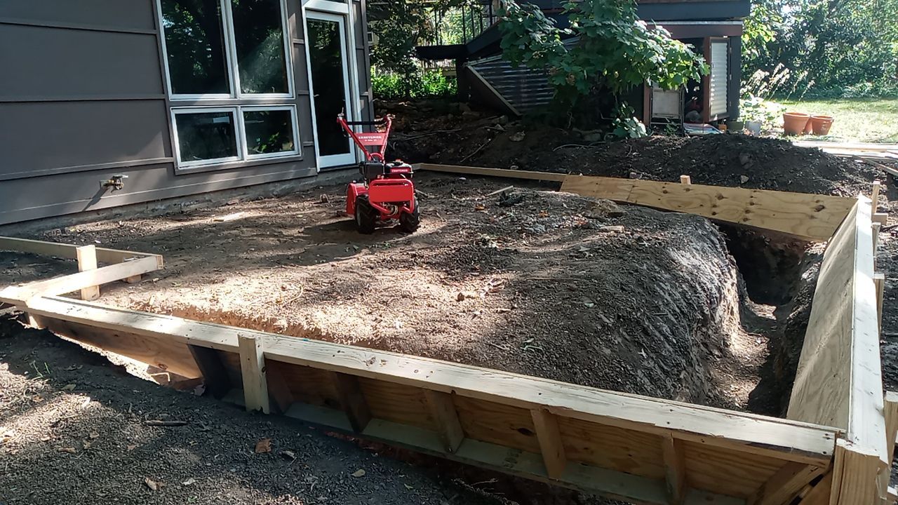 Back Yard Cantilivered Patio by LAND ESCAPES LLC