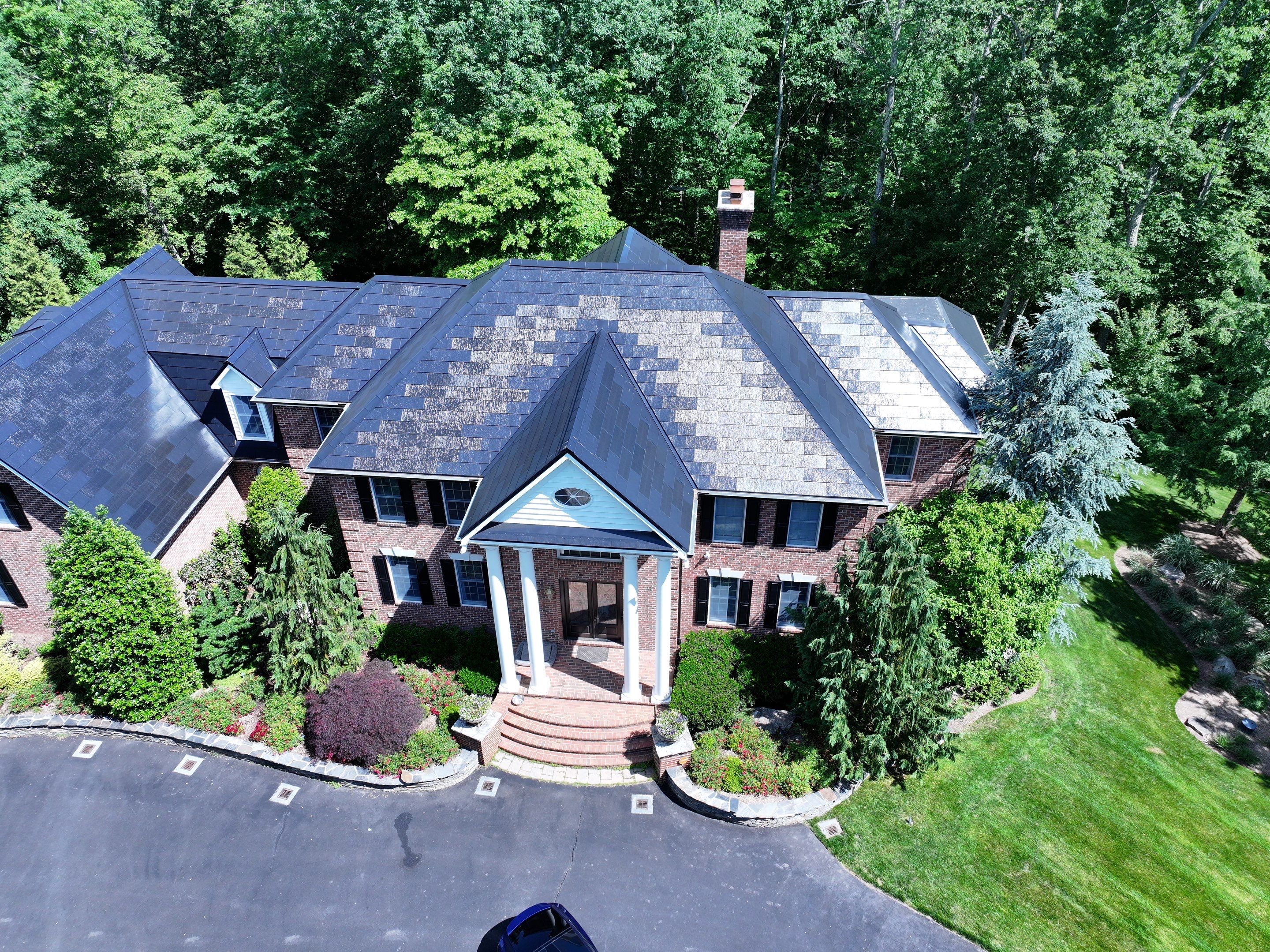 Tesla Solar Roof Replacement by American Home Contractors