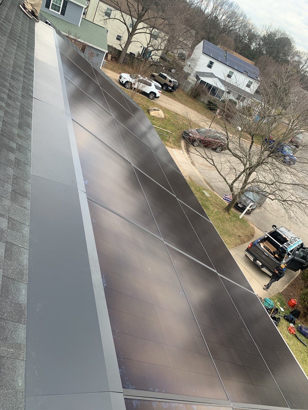 Roof Replacement with GAF Decotech integrated solar panels by American Home Contractors