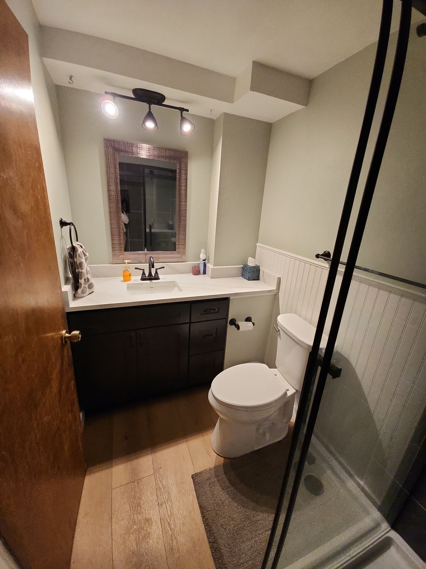 Modern Oatfield Bathroom Remodel Featuring Charcoal Shower and Dark Accents by American Made Construction 