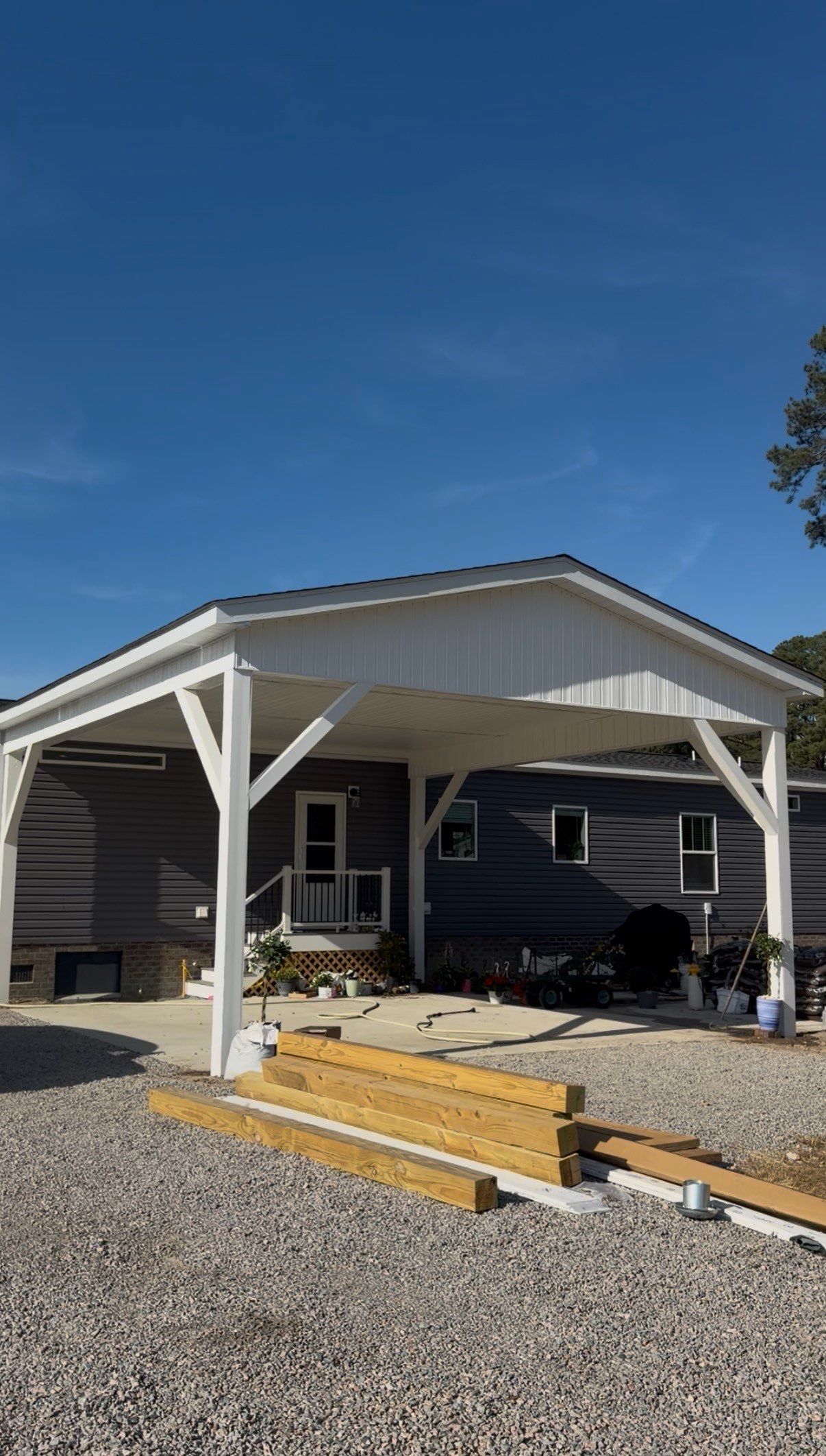 Custom Trex Covered Deck and Gabled Roof in Winterville by The Remodeling Company