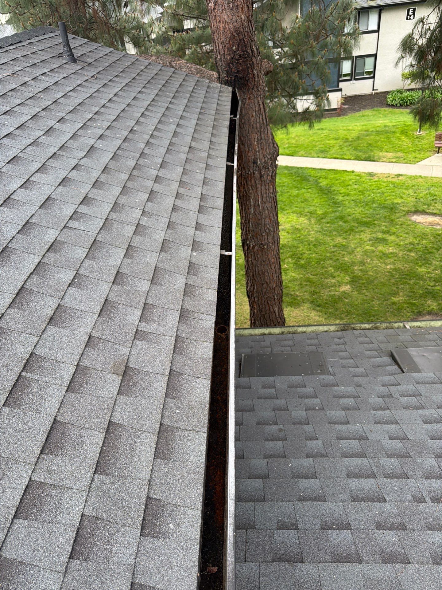 HOA gutter cleaning in Napa, CA, after  photo showing full gutters.