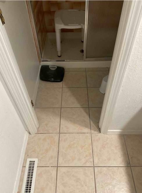New shower, flooring, and countertop by The Shower Company