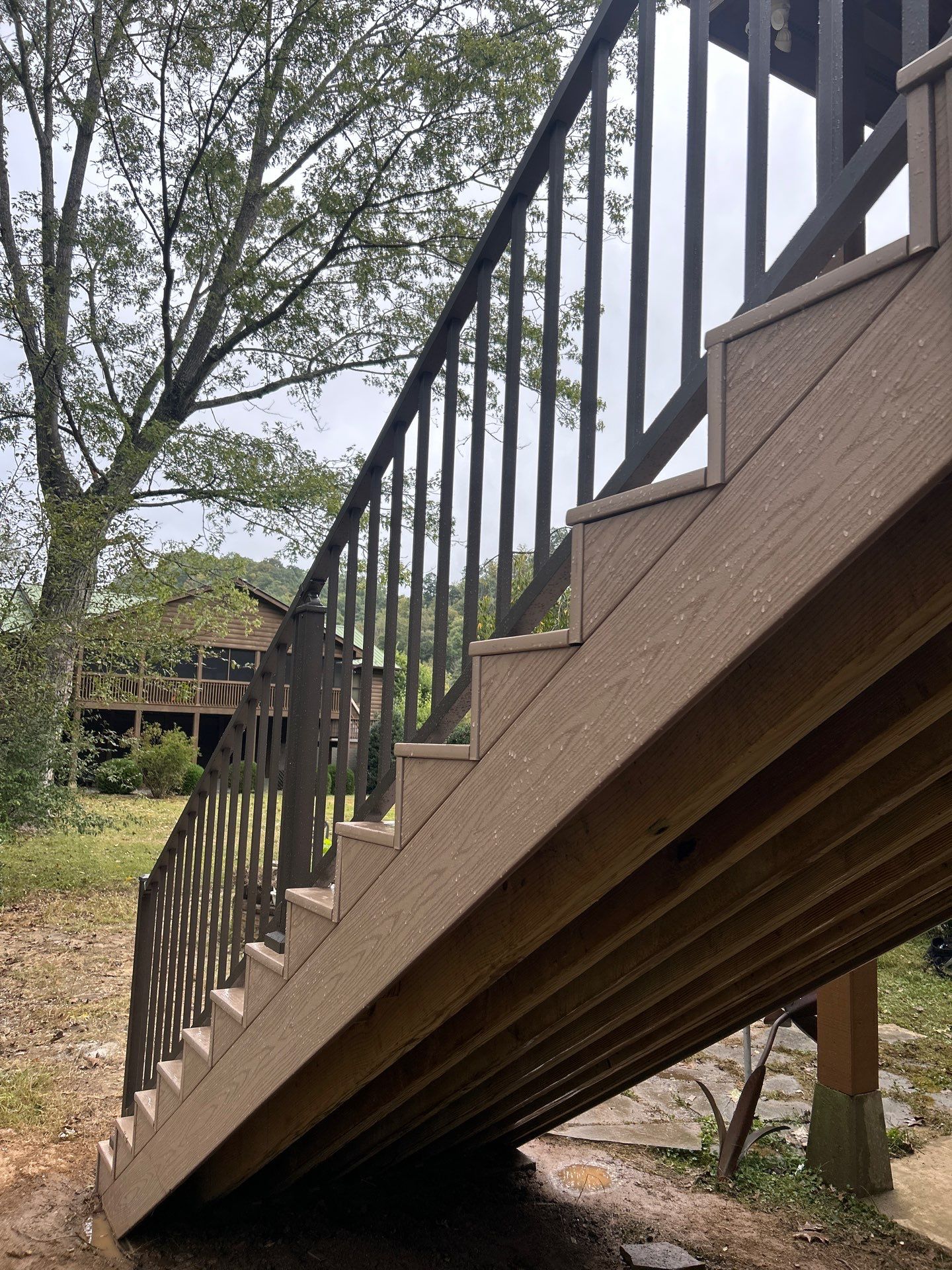 Log Cabin Wrap-Around Deck and External Staircase Installation in Caldwell by Walnut Hollow Decks & Outdoor Living