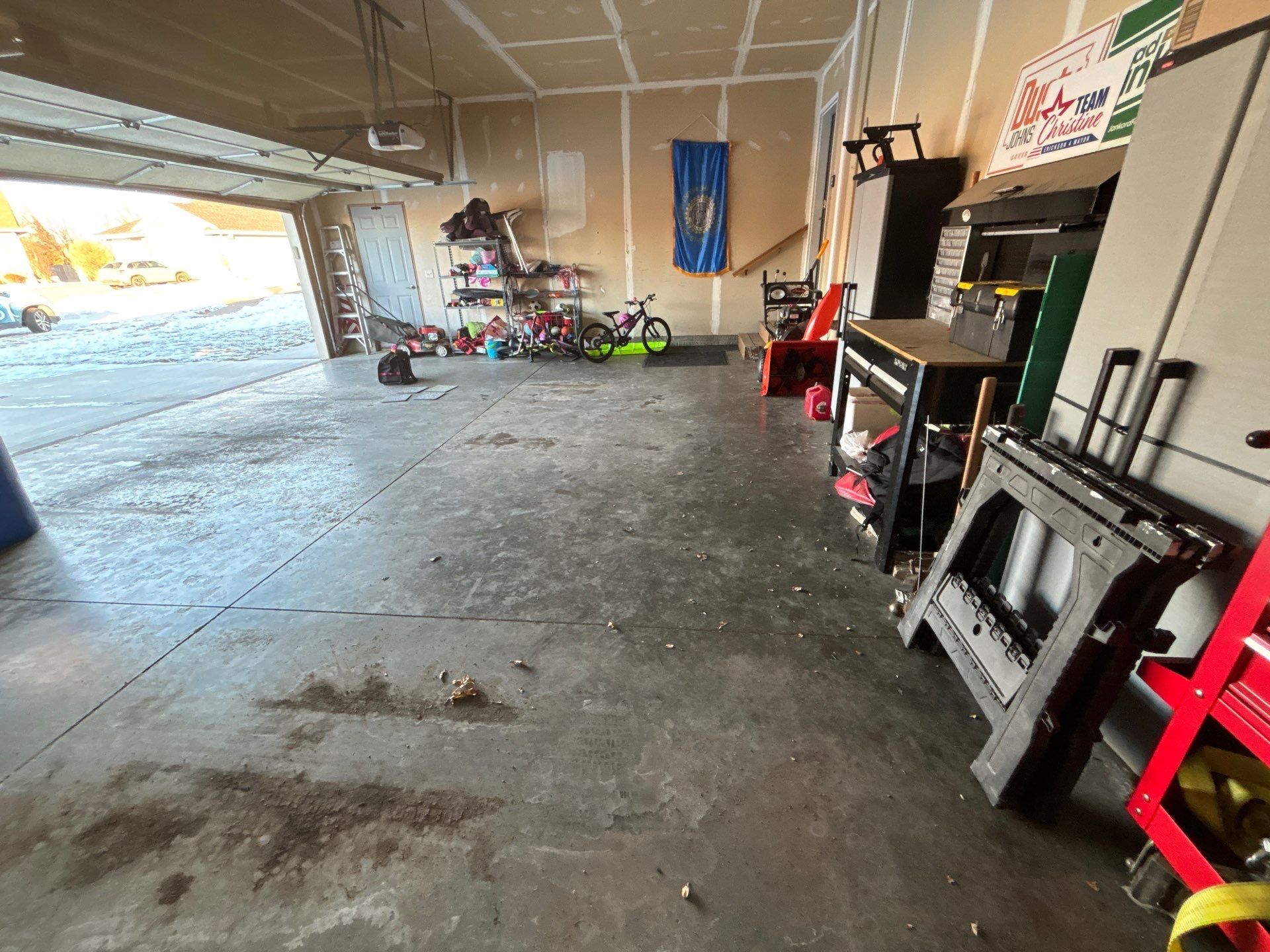 Custom Grey Speckled Epoxy Floor Coating for Sioux Falls Garage by Select Painting, Coatings & Garage Cabinets