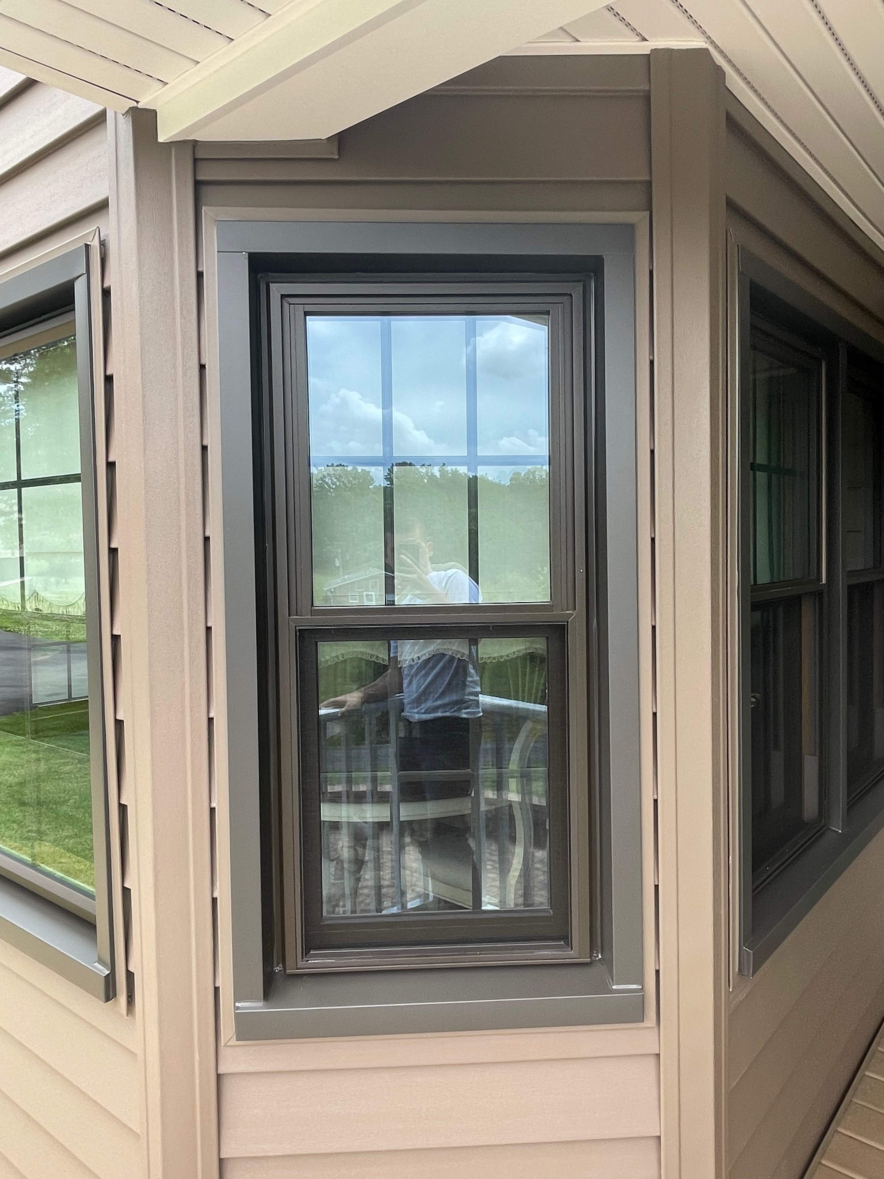 Exterior remodel including window replacement by American Home Contractors