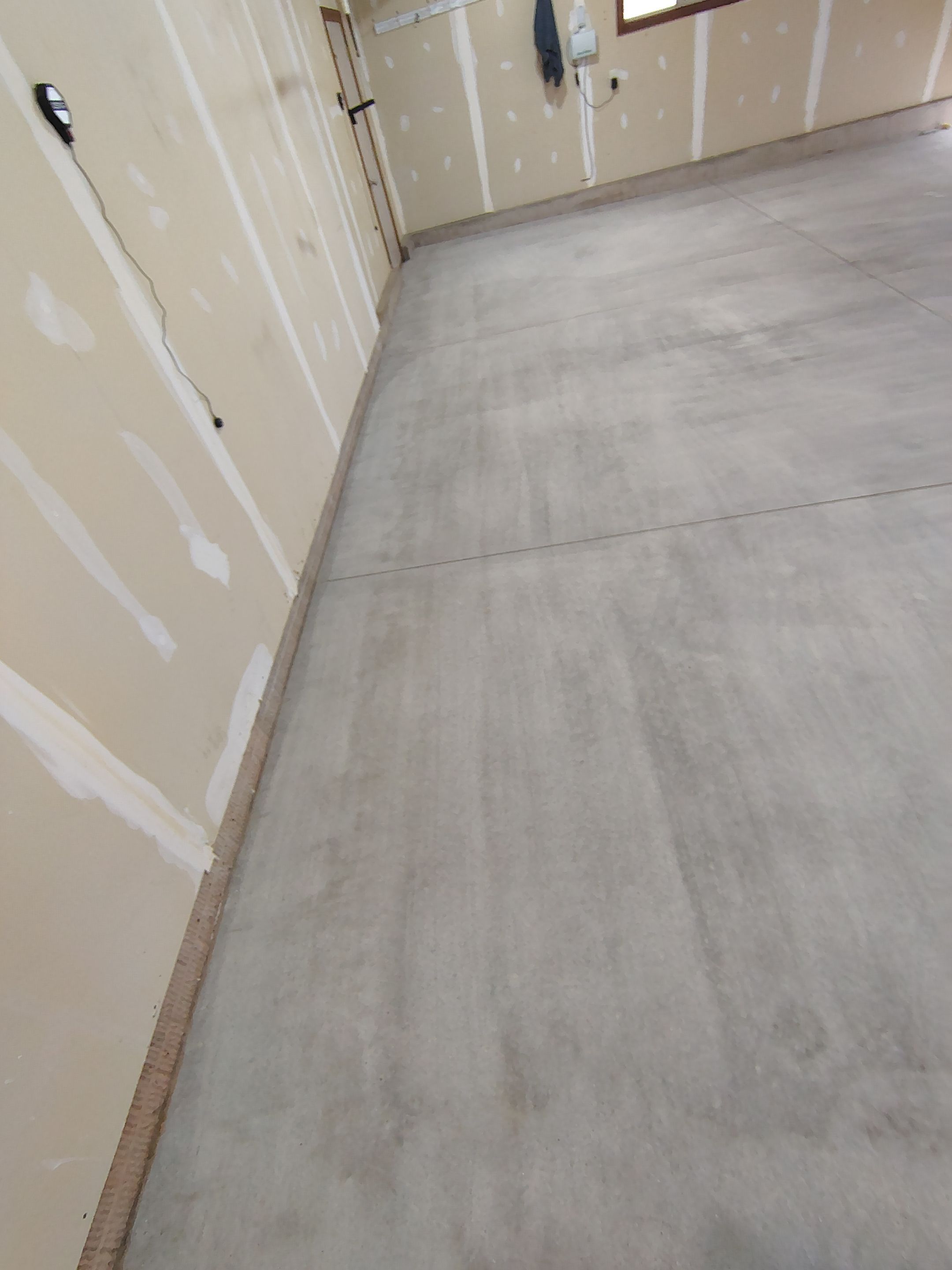 Multi-Car Garage Concrete Coating and Epoxy Finish in Sioux Falls by Select Painting, Coatings & Garage Cabinets