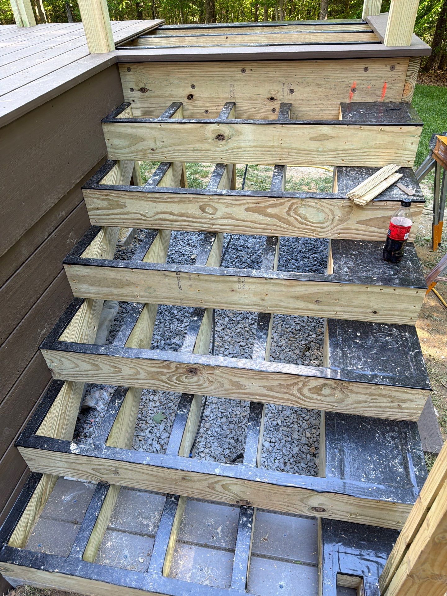 Custom Composite Deck and White Vinyl Railing Installation in Fayetteville by Walnut Hollow Decks & Outdoor Living