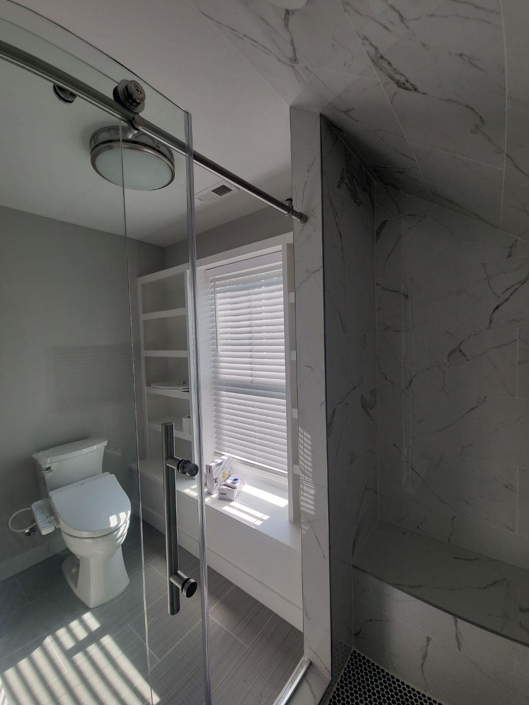 From Rafters to Retreat: An Attic Transformed with a Luxe Bath Escape by Elite Remodeling and Design LLC