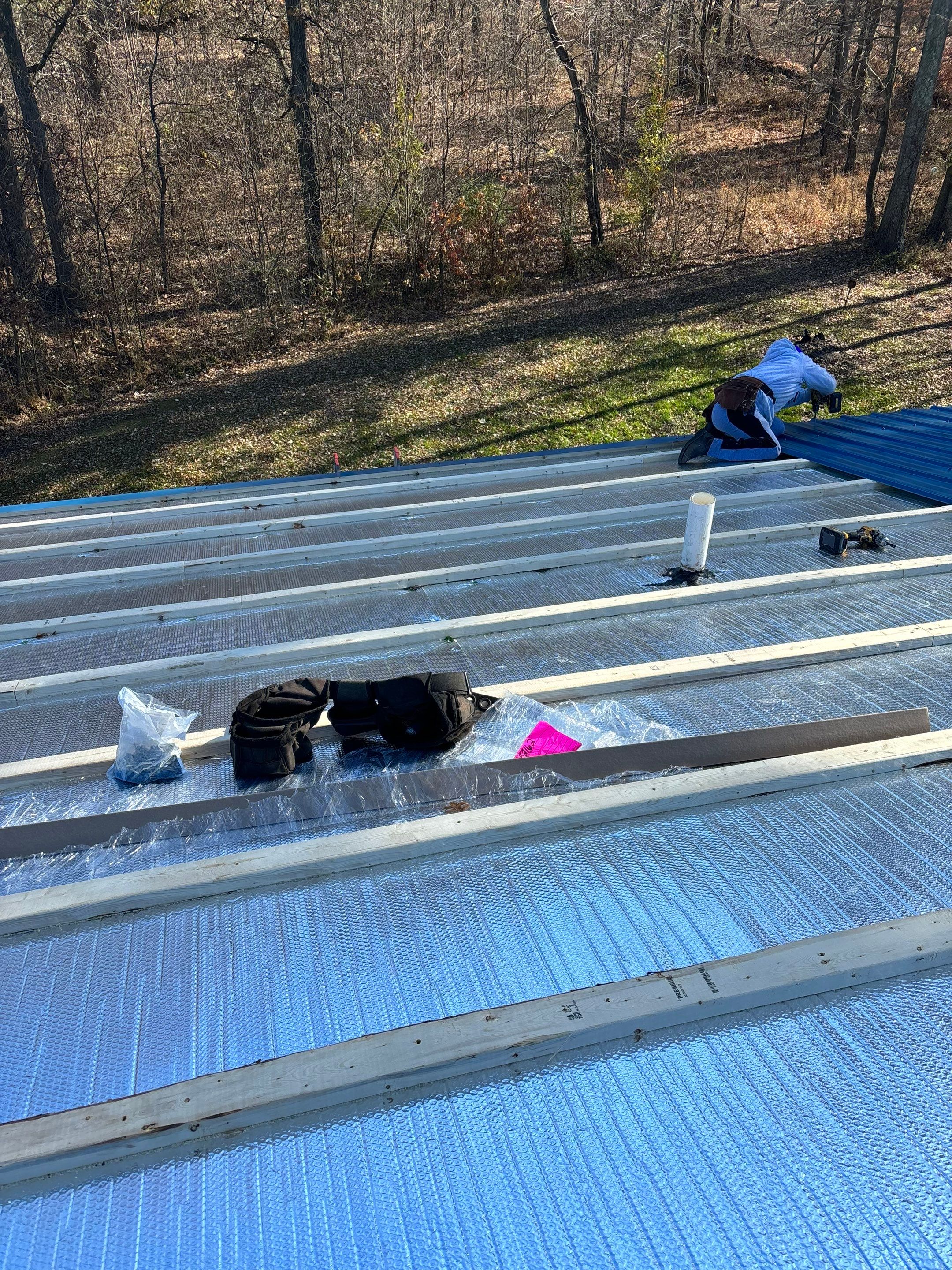 Residential Roofing Installation using Custom Metal and insulation by Storm Contracting 
