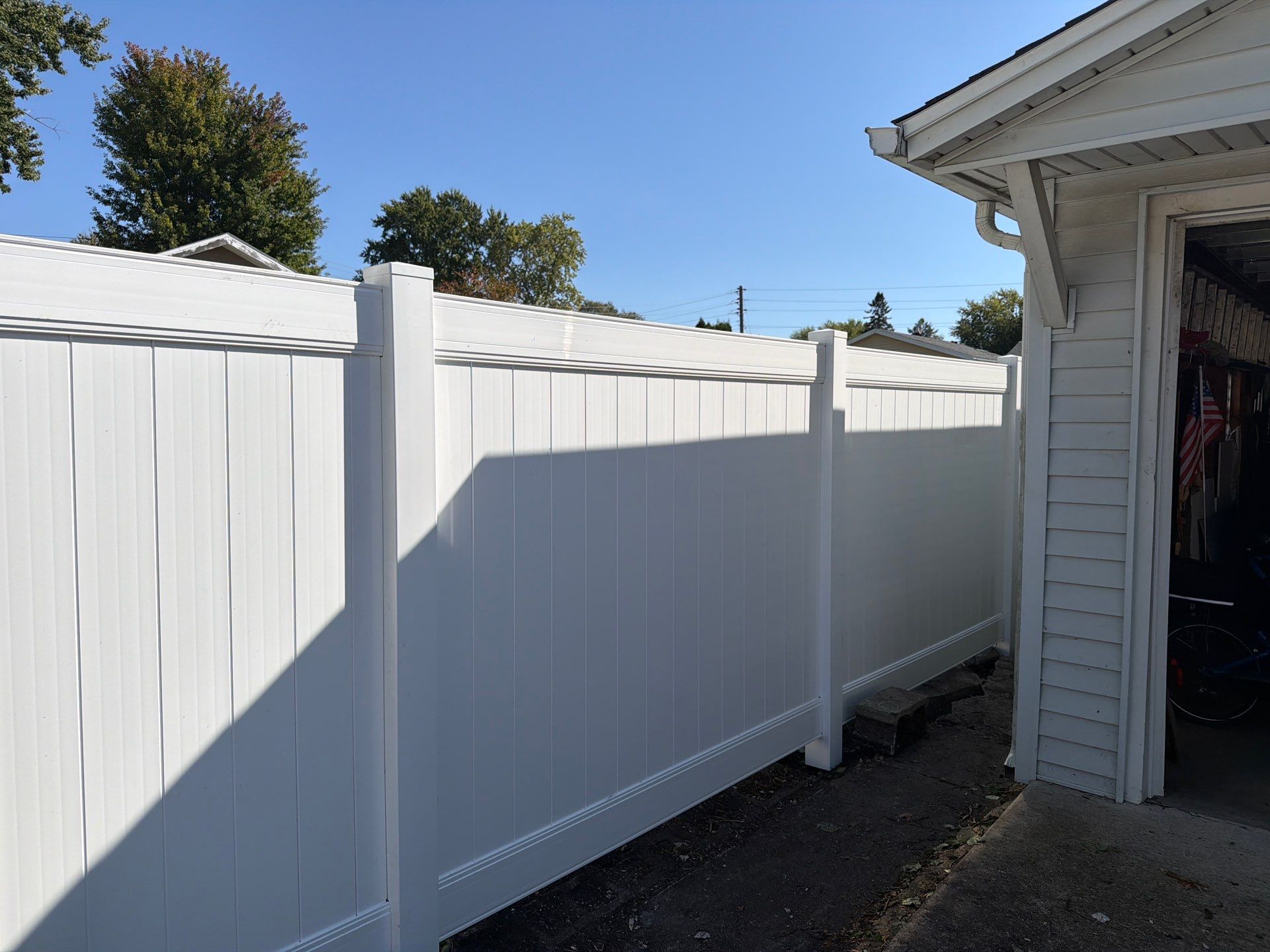 Custom Vinyl Privacy and Black Chain Link Fence Installation in Cedar Falls by Perfect Picket Fence and Stain