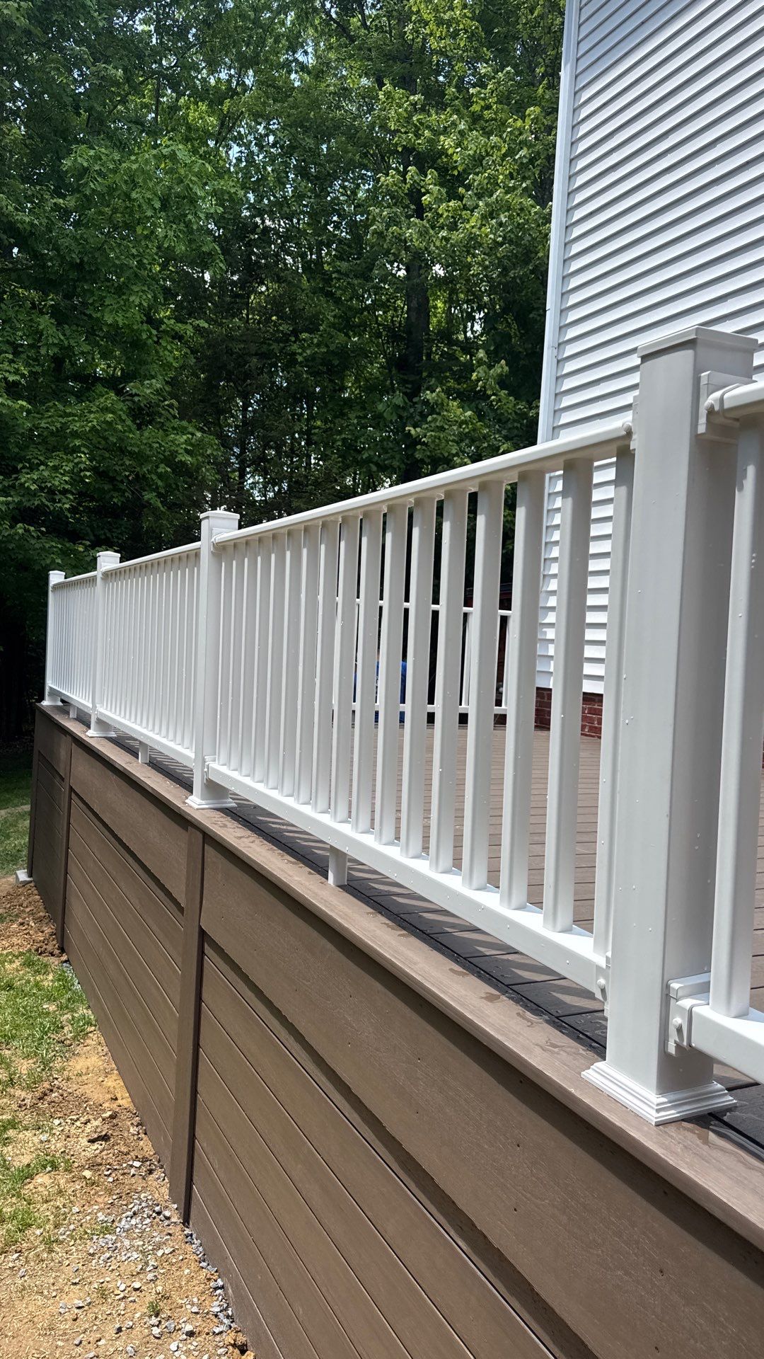 Custom Composite Deck and White Vinyl Railing Installation in Fayetteville by Walnut Hollow Decks & Outdoor Living