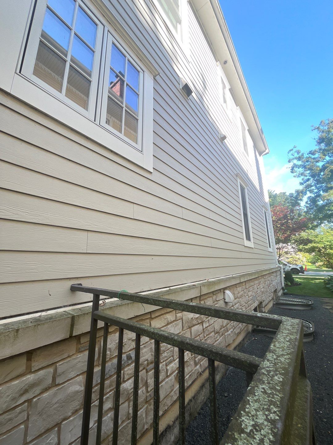 Hardie Board House & Detached Garage Soft Washing by Northern Power Washing LLC.