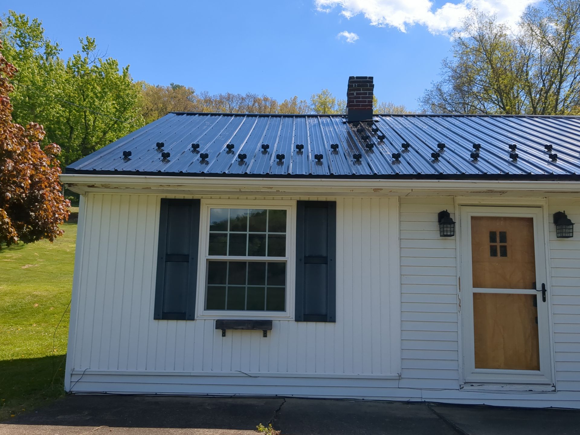 Black ABM Metal Roof Replacement  by Esh Builders