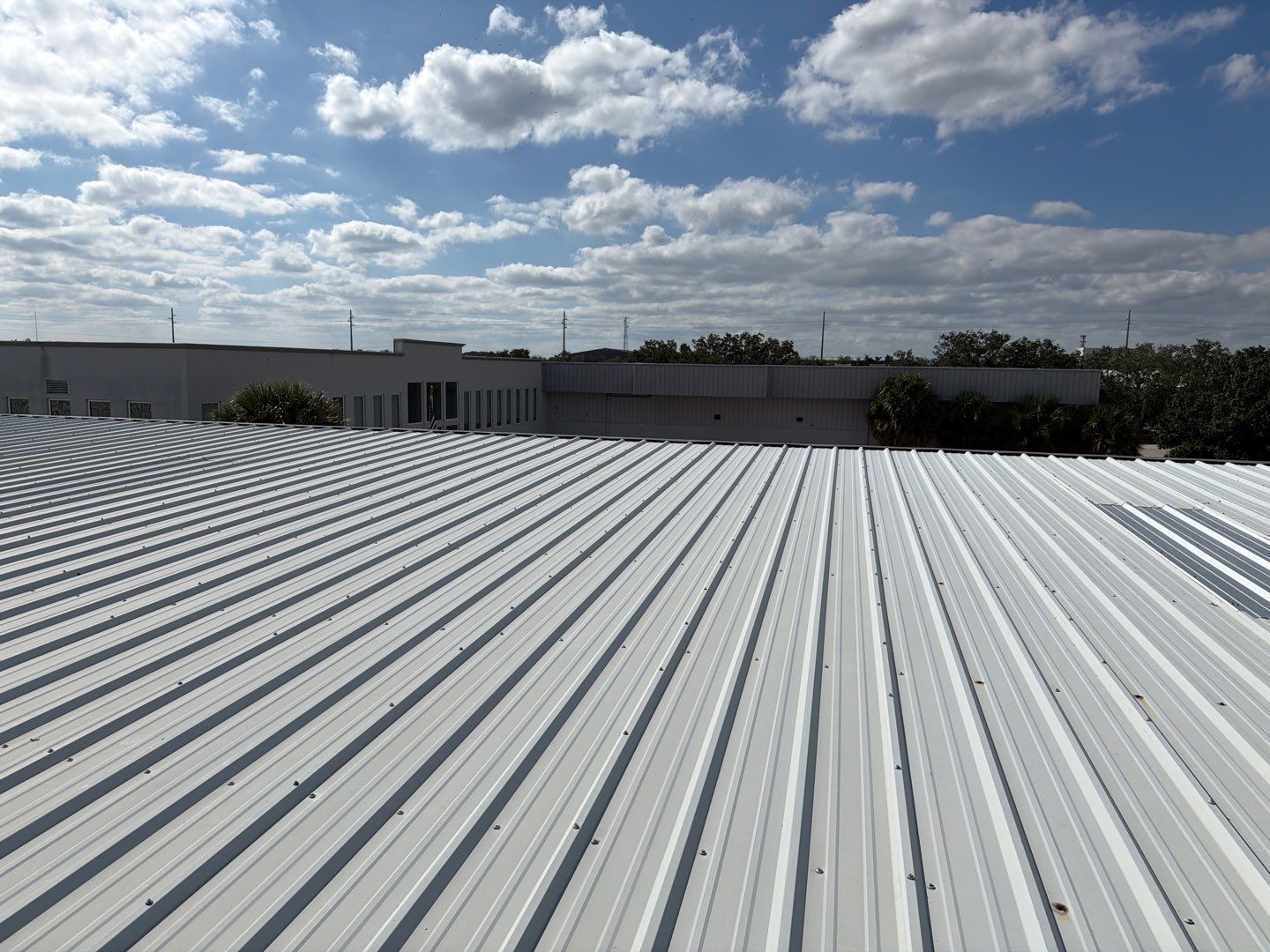 Orlando Commercial Metal Roof Restoration and Silicone Coating System by CES Roofing