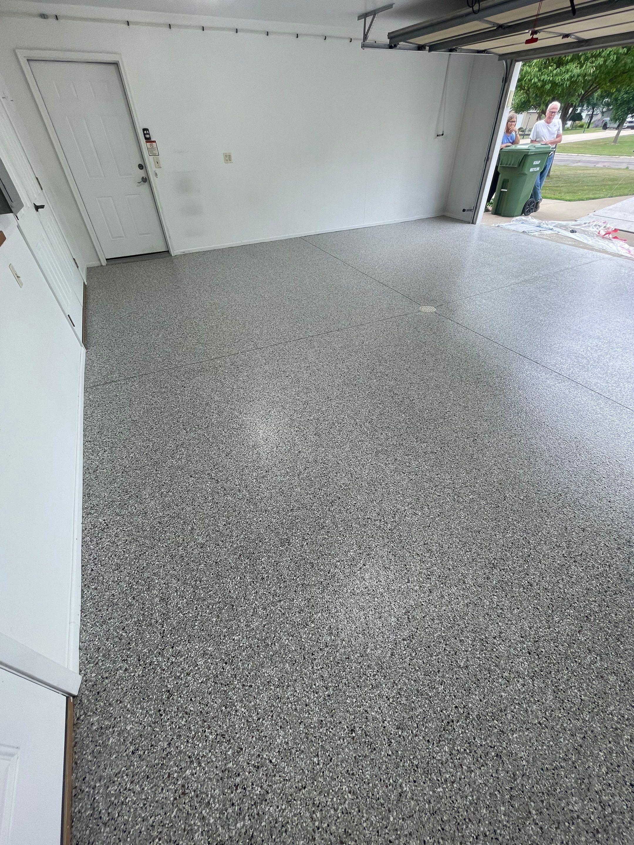 Coyote Flake Garage Floor Coating in Worthington, Minnesota by Select Painting, Coatings & Garage Cabinets