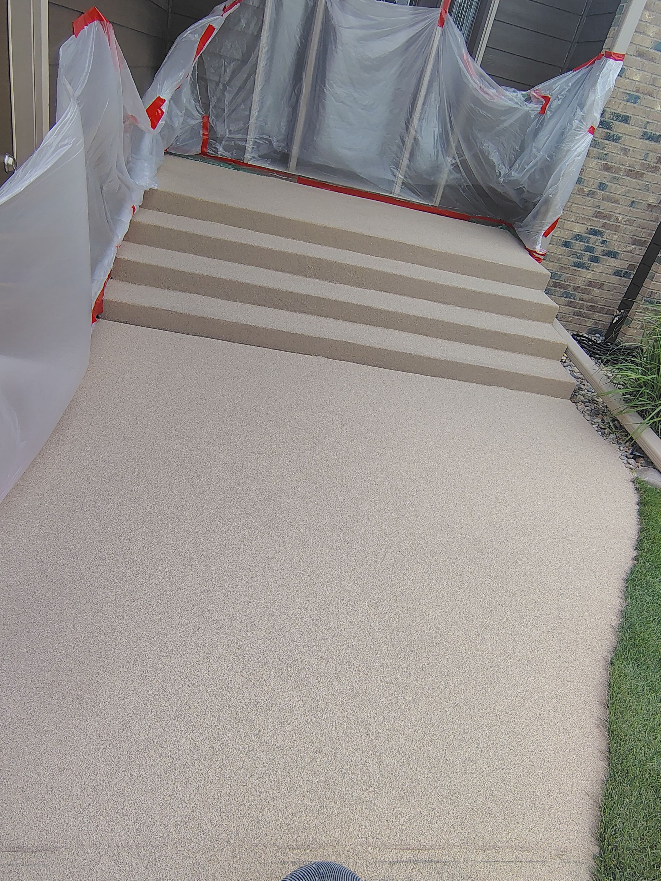 Textured Concrete Coating and Entryway Restoration in Madison by Select Painting, Coatings & Garage Cabinets