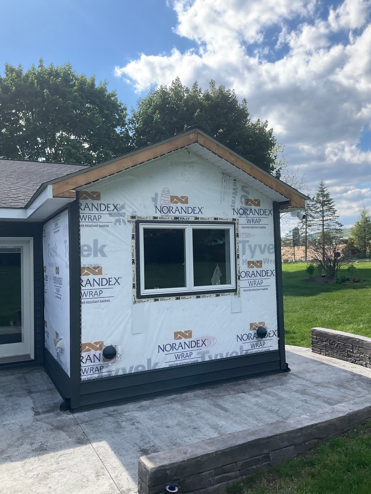 Nightfall Exterior Siding Replacement and Stone Veneer in Halifax by Esh Builders